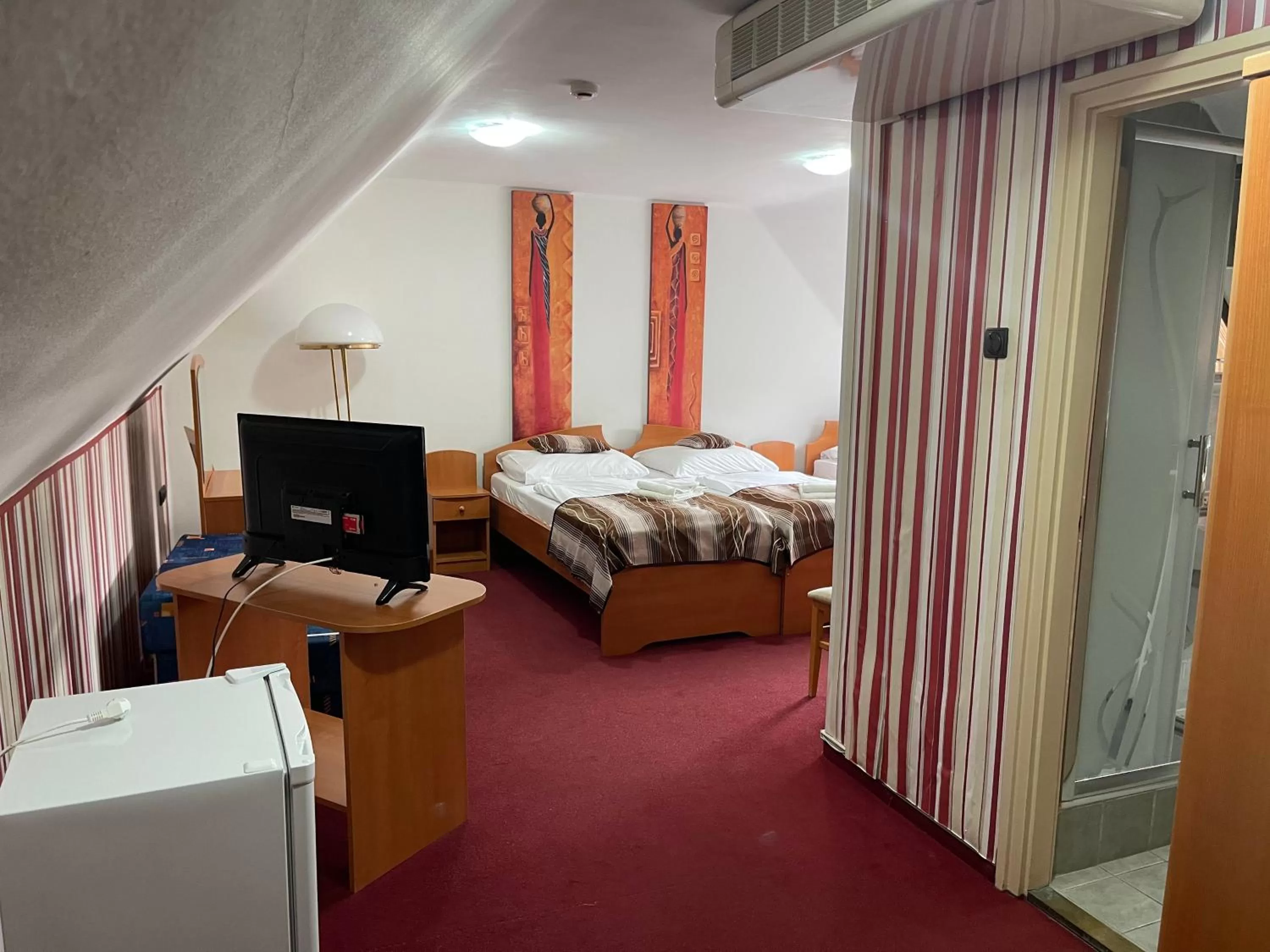 Bed in Hotel Minaret&Étterem