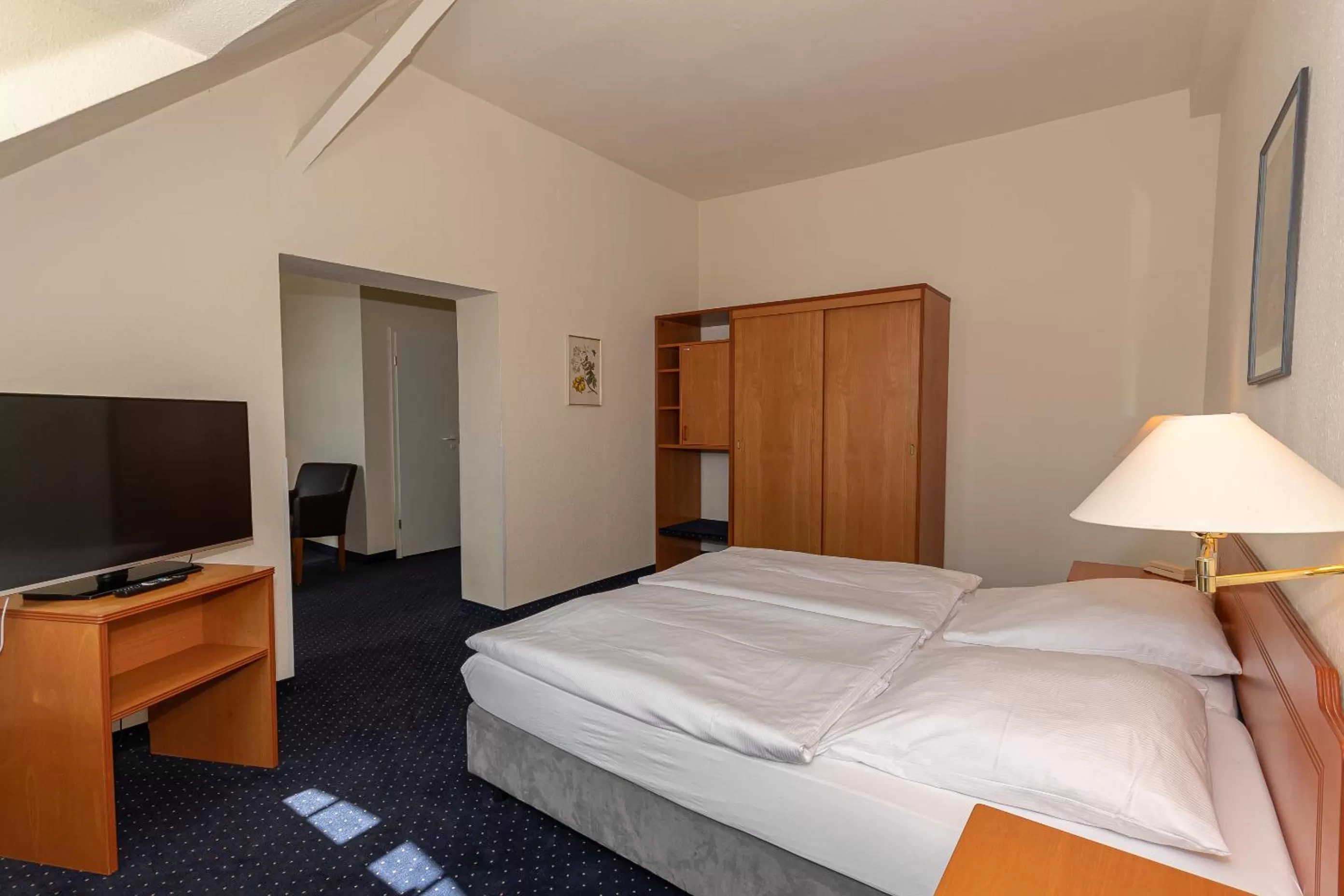 Photo of the whole room, Bed in Kurhotel Sassnitz