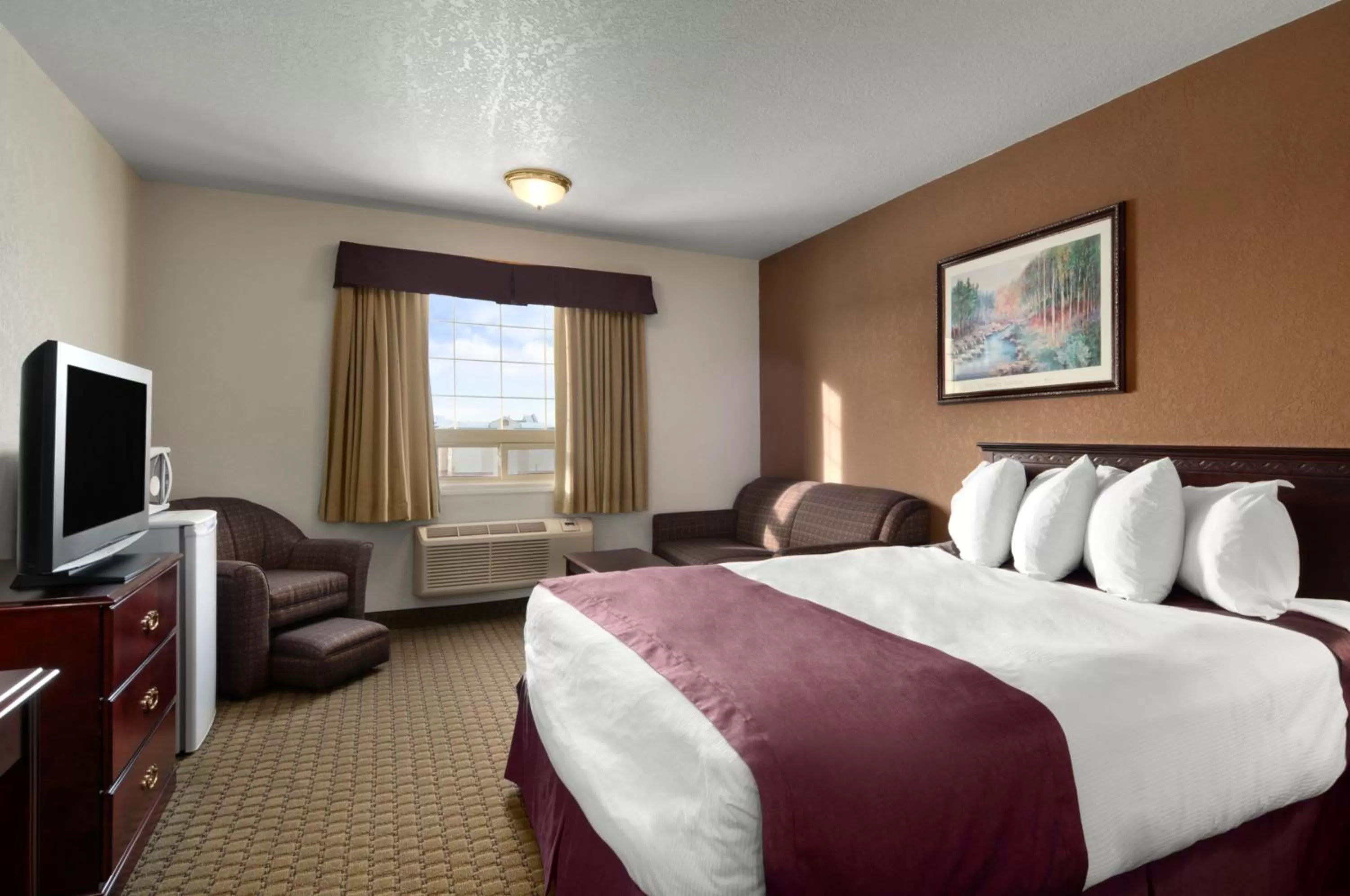Photo of the whole room, Bed in Ramada by Wyndham Red Deer Hotel & Suites
