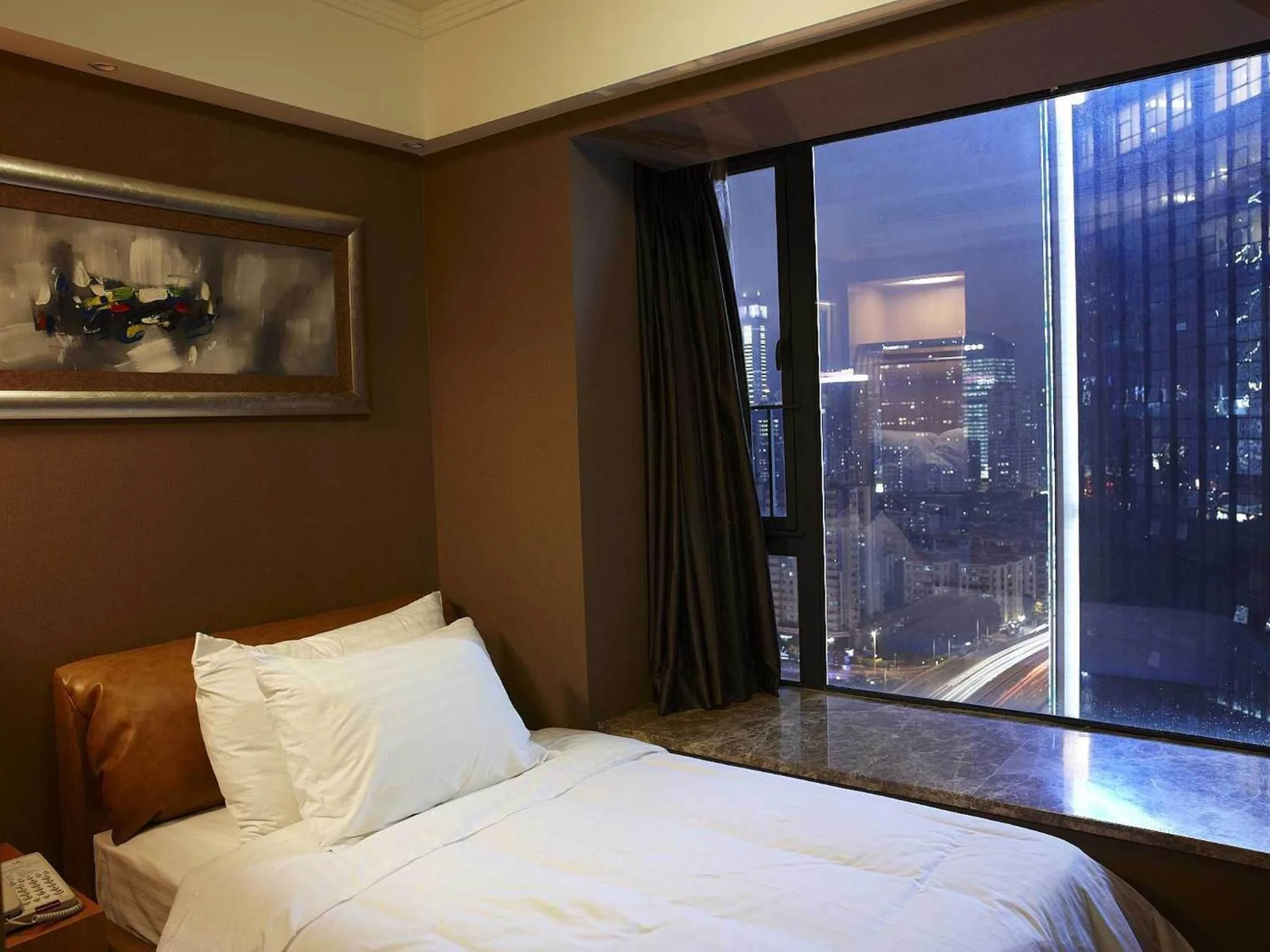Bed in 广州丹顿行政公寓-Dan Executive Apartment Guangzhou Zhujiang New Town