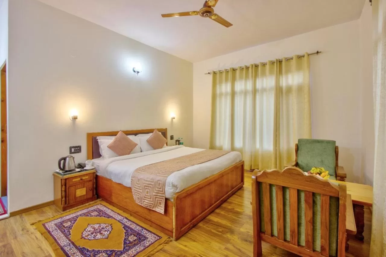 Bed in Ayushman Hotels