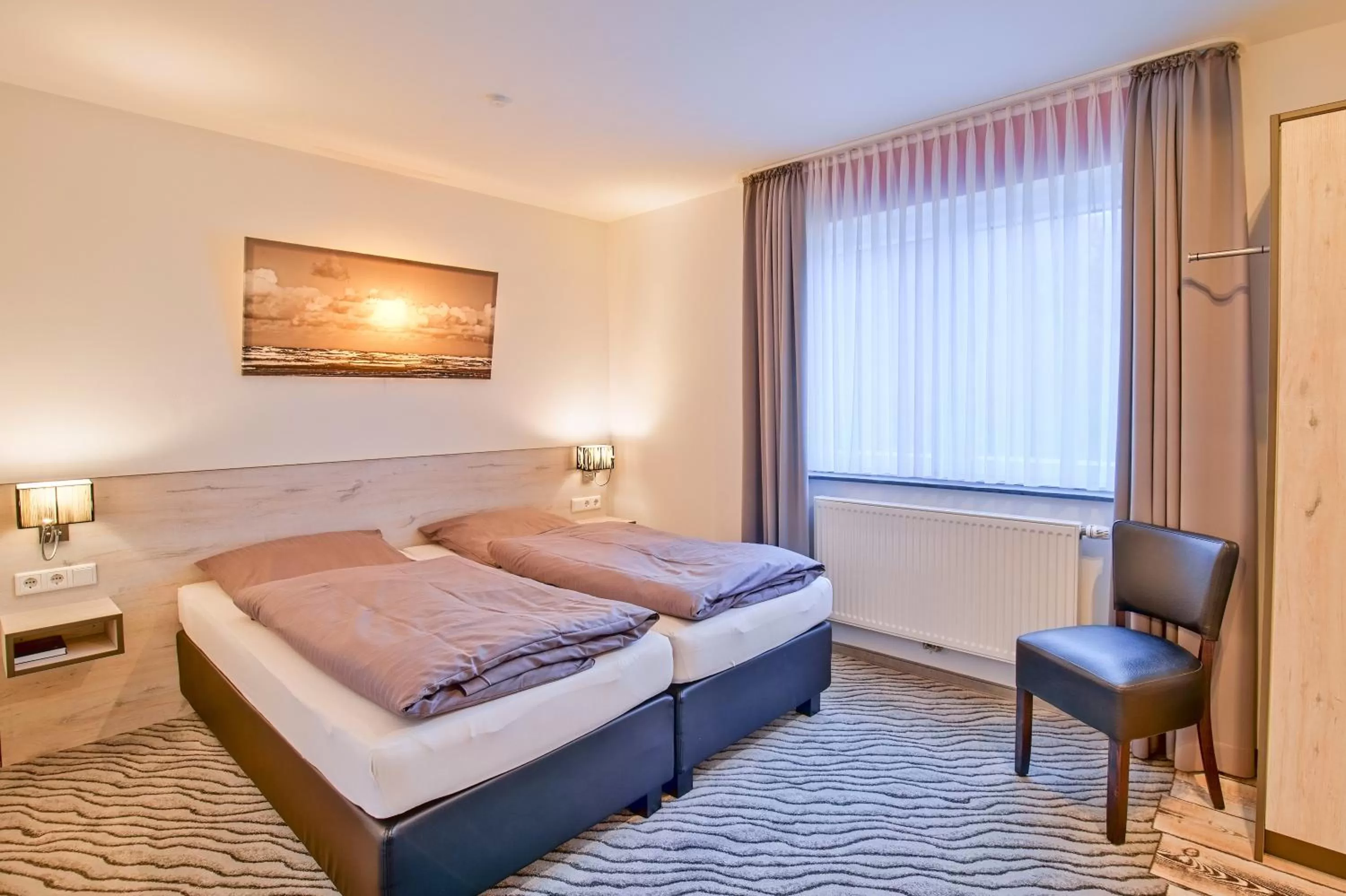 Photo of the whole room, Bed in Hotel Im Schützenhof, Jever