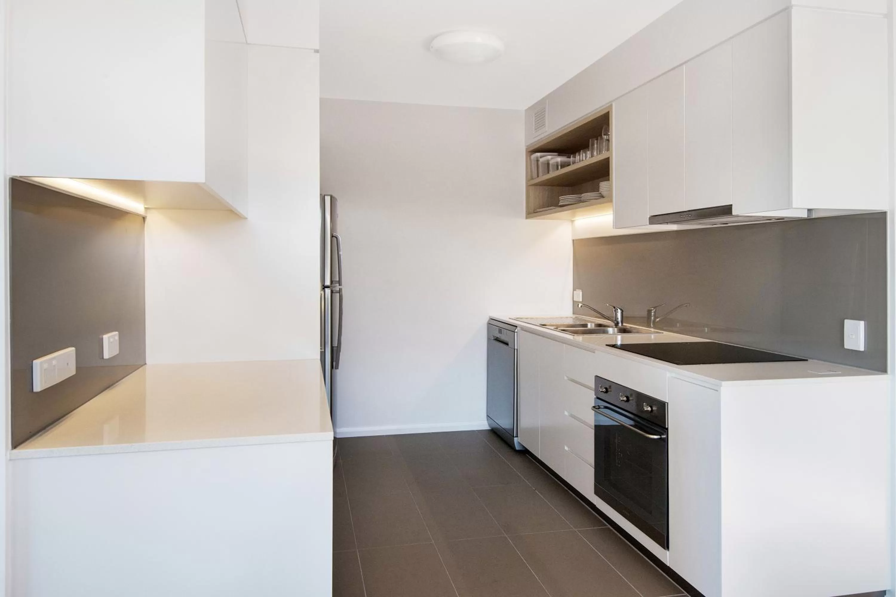 Kitchen or kitchenette in Allure Hotel & Apartments