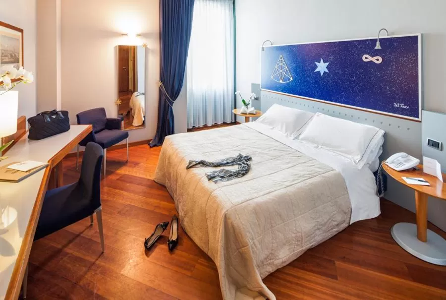 Bed in Cosmo Hotel Torri