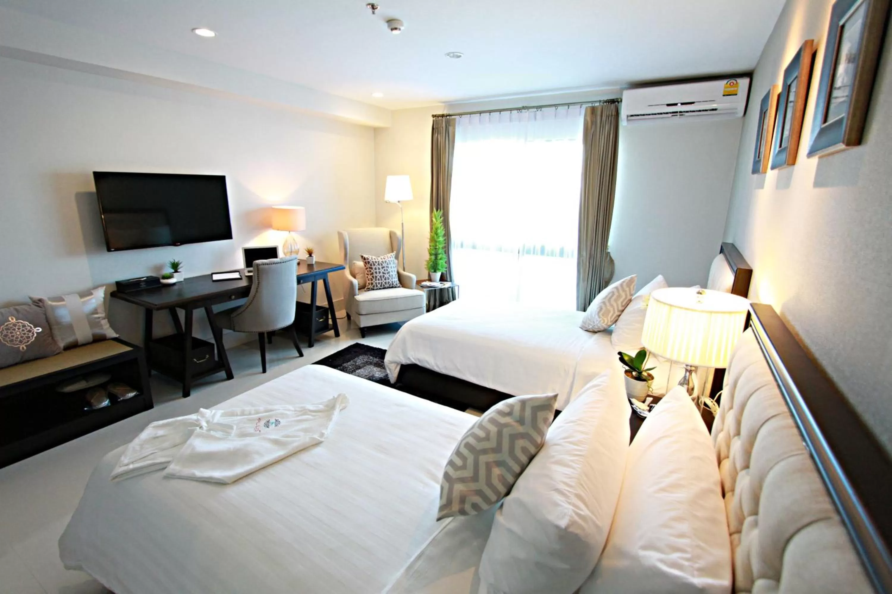 Photo of the whole room, Bed in SN Plus Hotel - SHA Plus