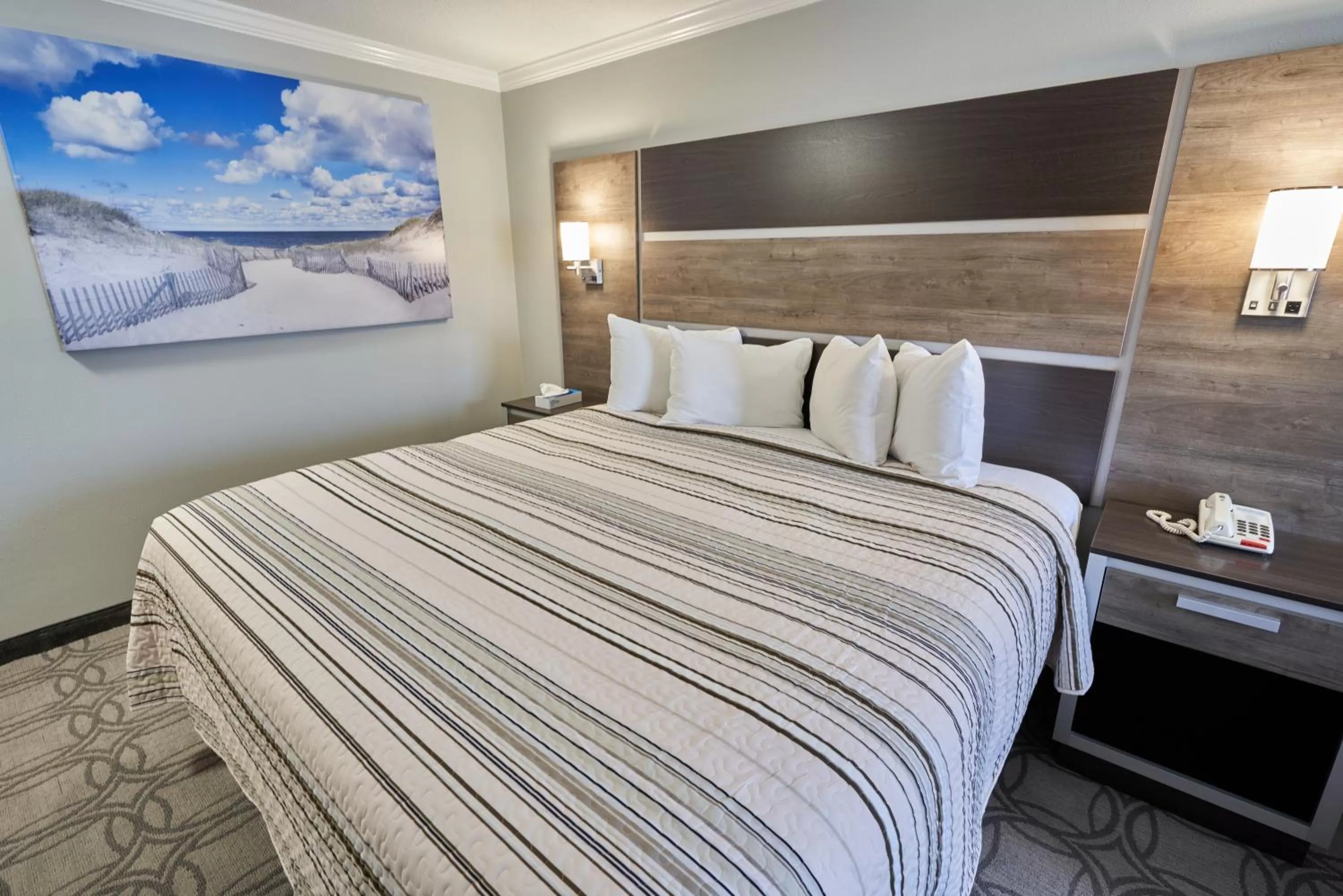 Bed in Ambassador Inn and Suites