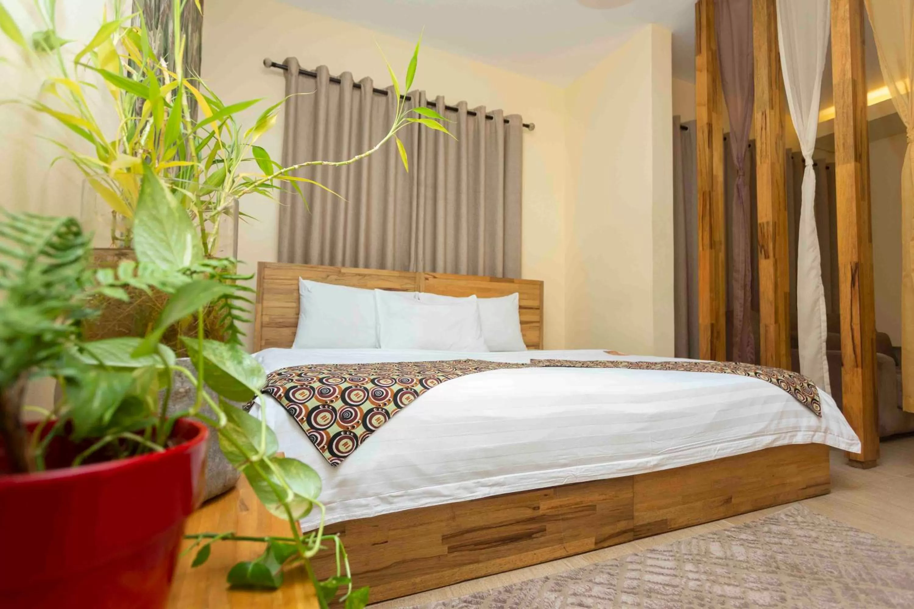 Bed in Roots Hotel Apartment