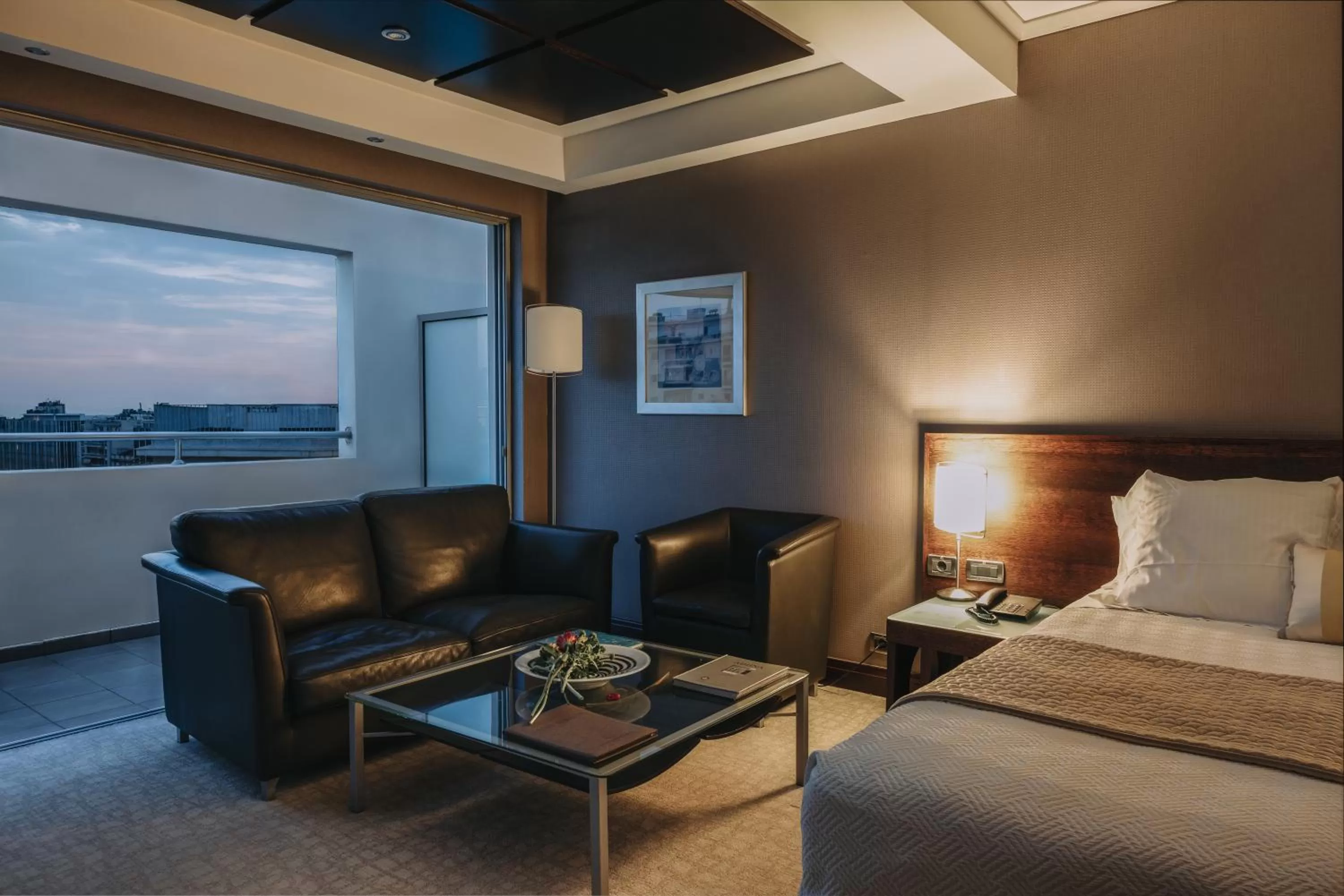 Seating area, Bed in The Athenian Callirhoe Exclusive Hotel