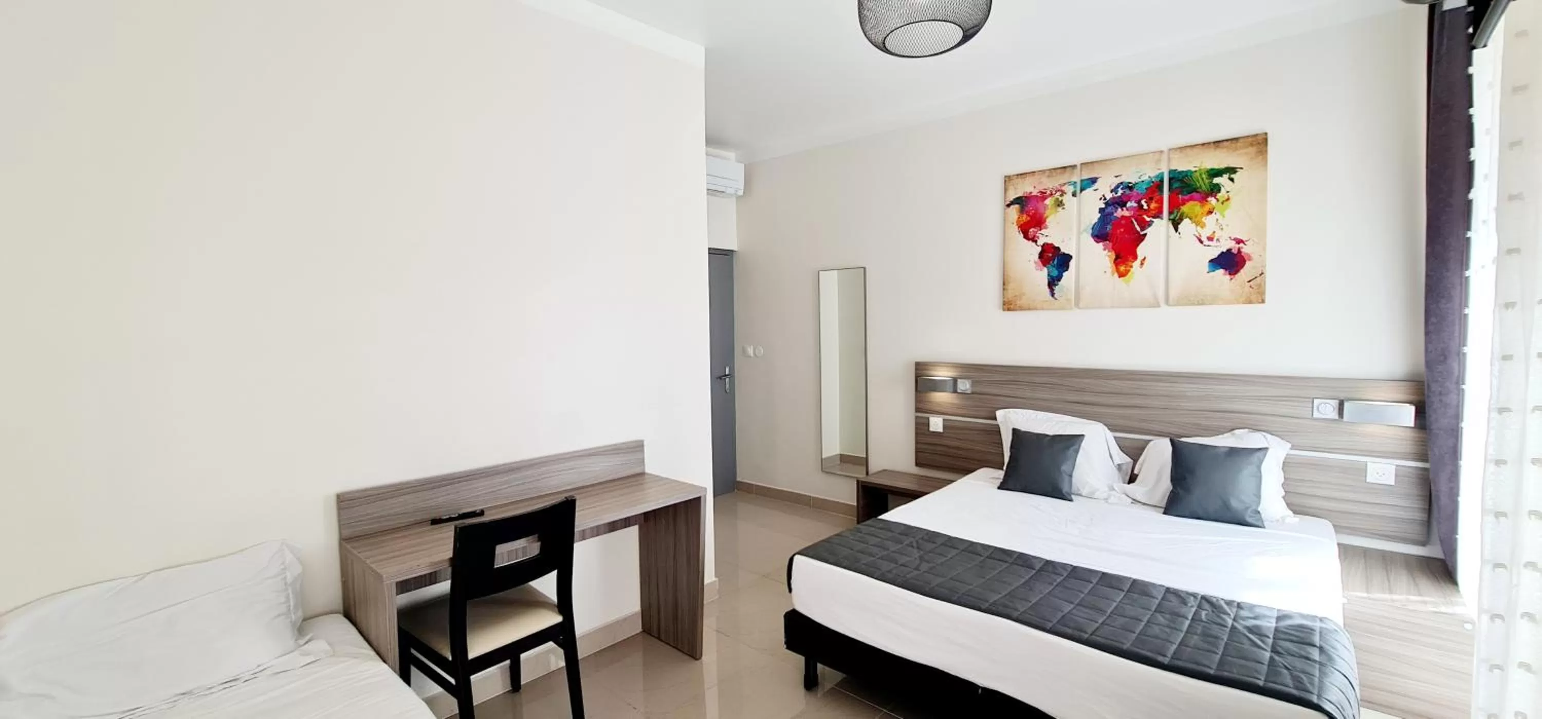 Bed in ESPERANCE HOTEL