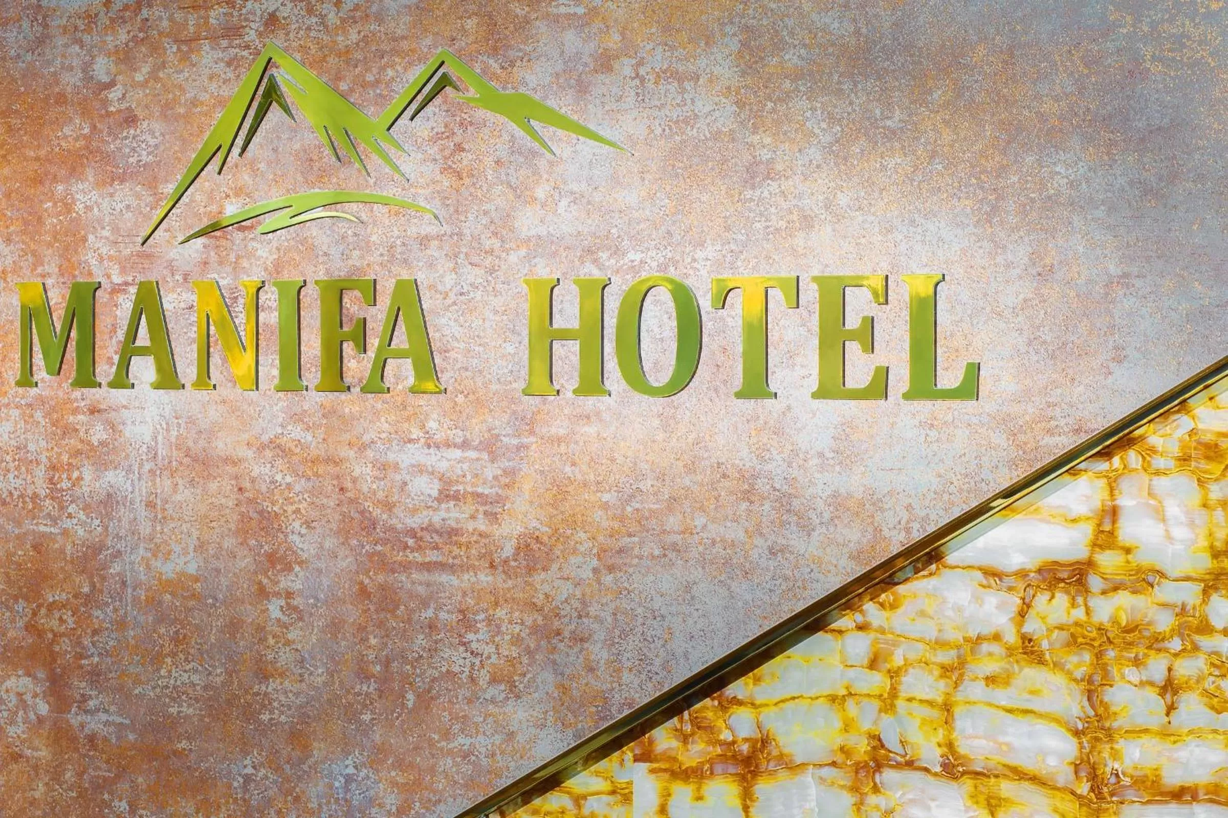 Property Logo/Sign in Manifa Hotel