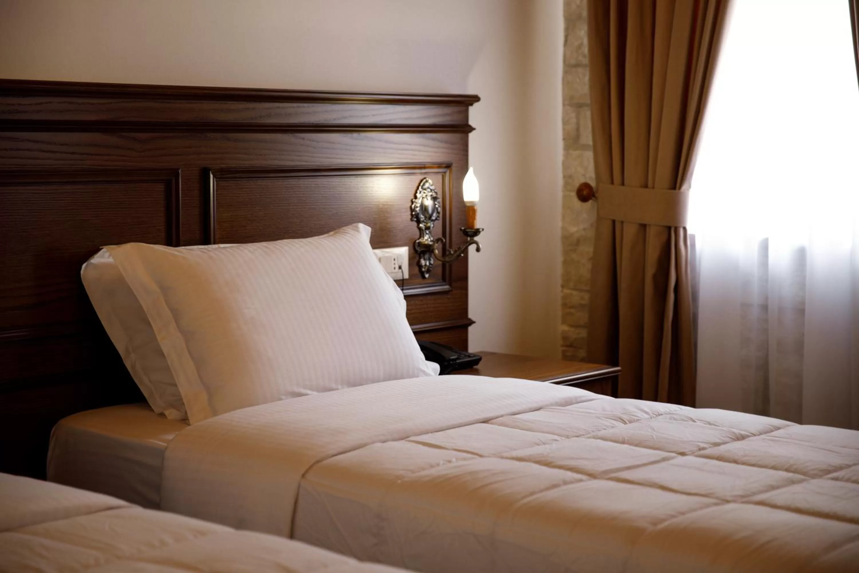 Bed in Rose Garden Hotel