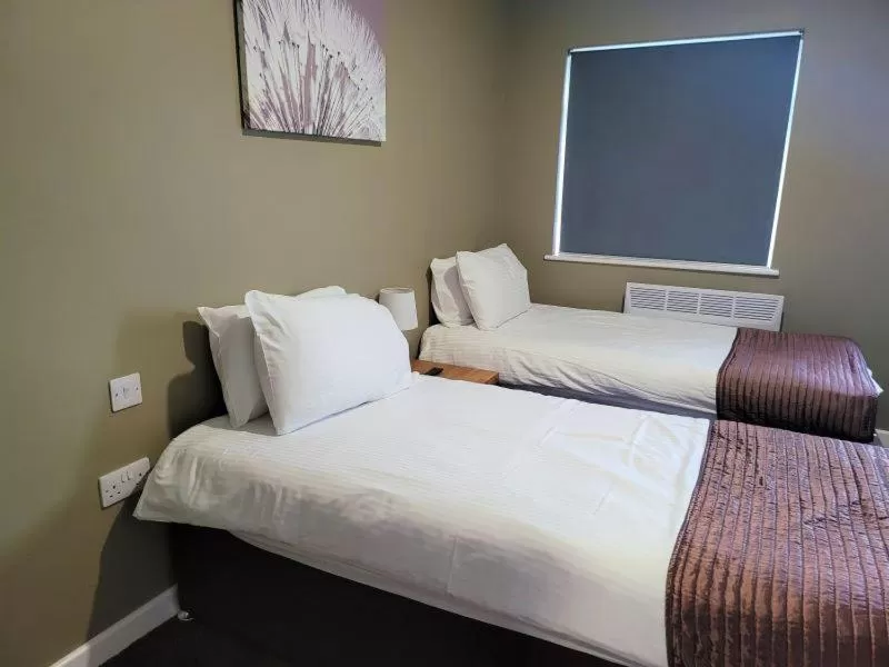 Bed in The Oakwood Hotel