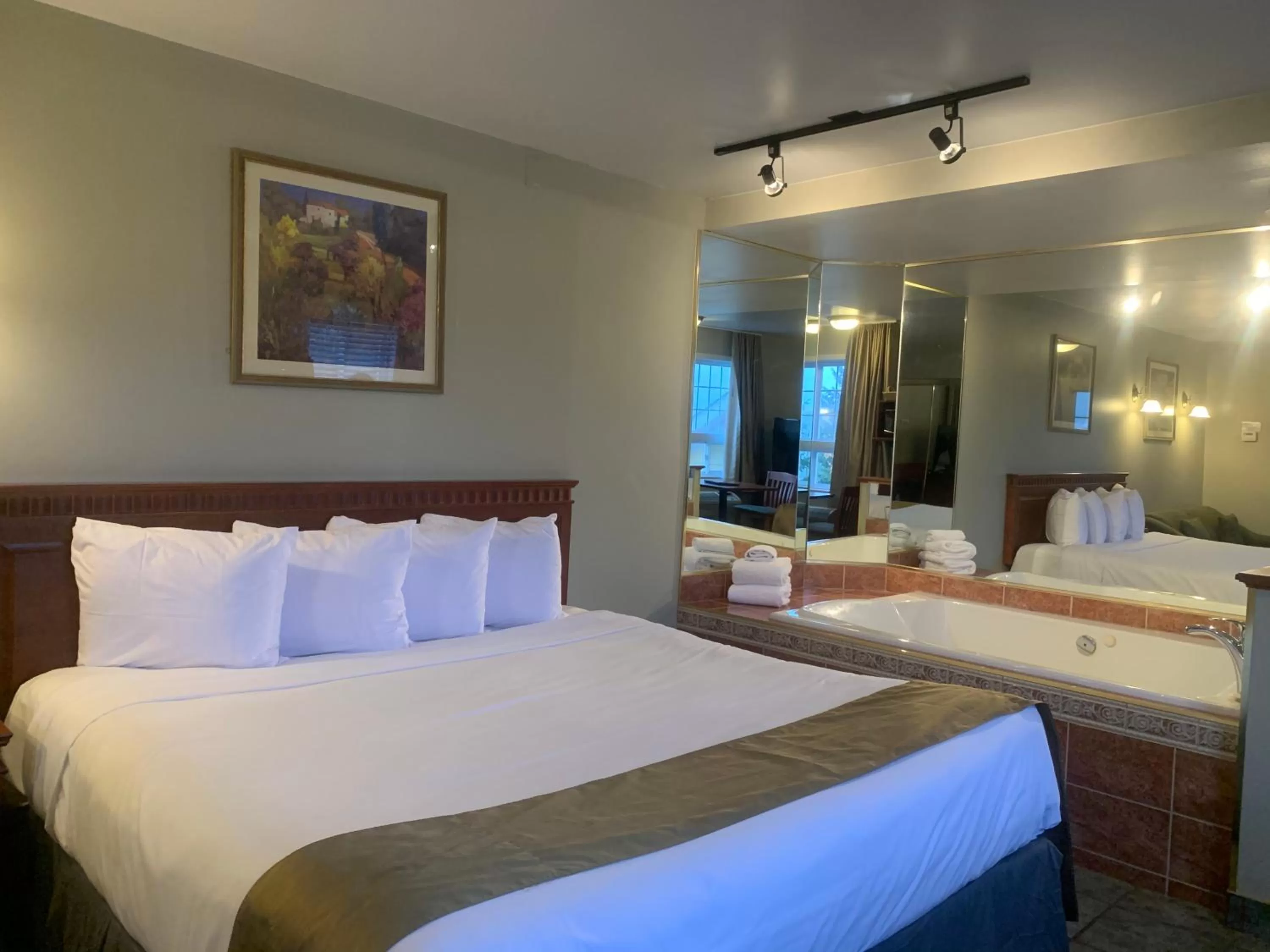 Bedroom, Bed in Hotel and Suites Les Laurentides