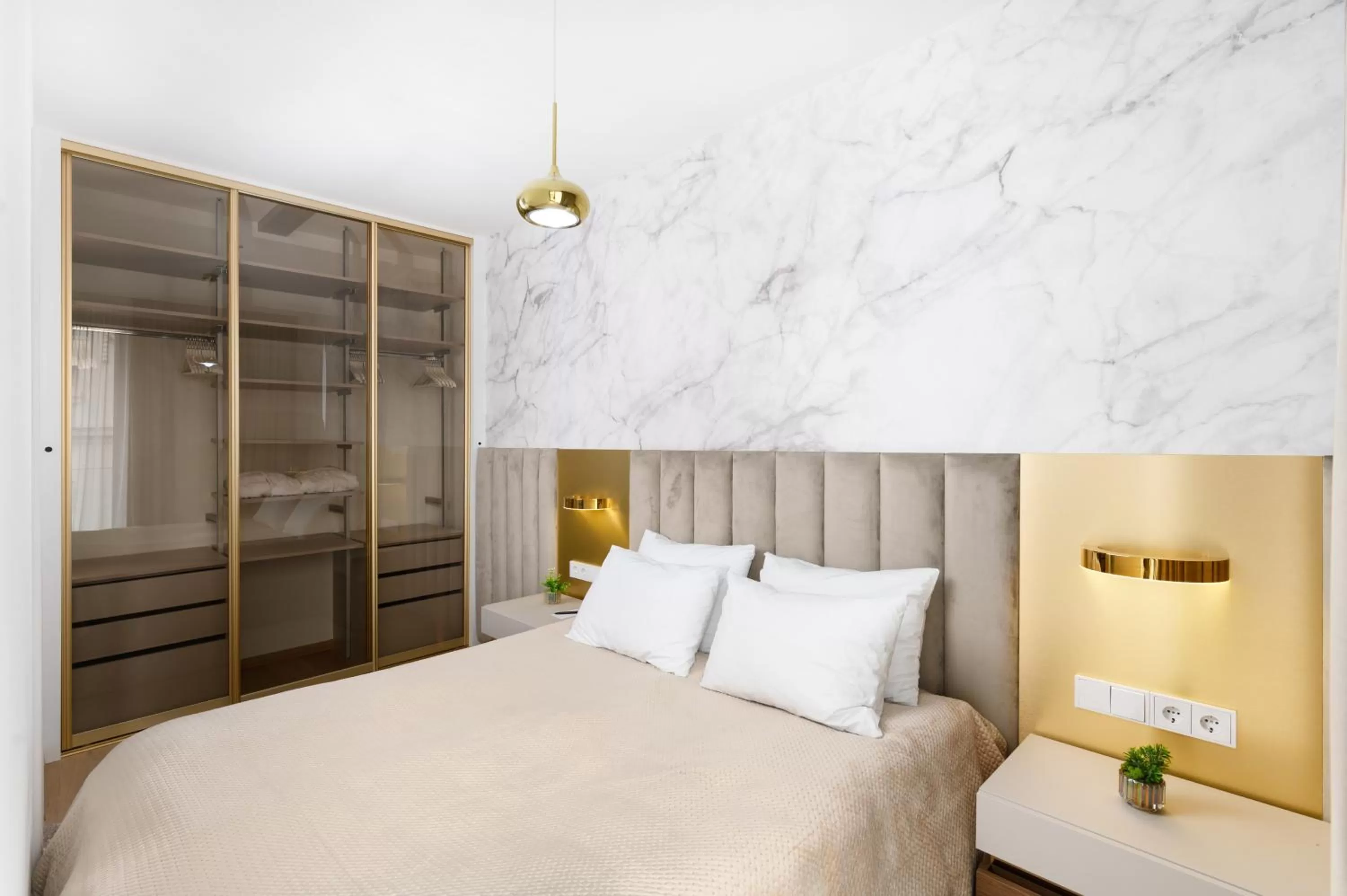 Bed in Emerald Downtown Luxury Suites by Continental Group