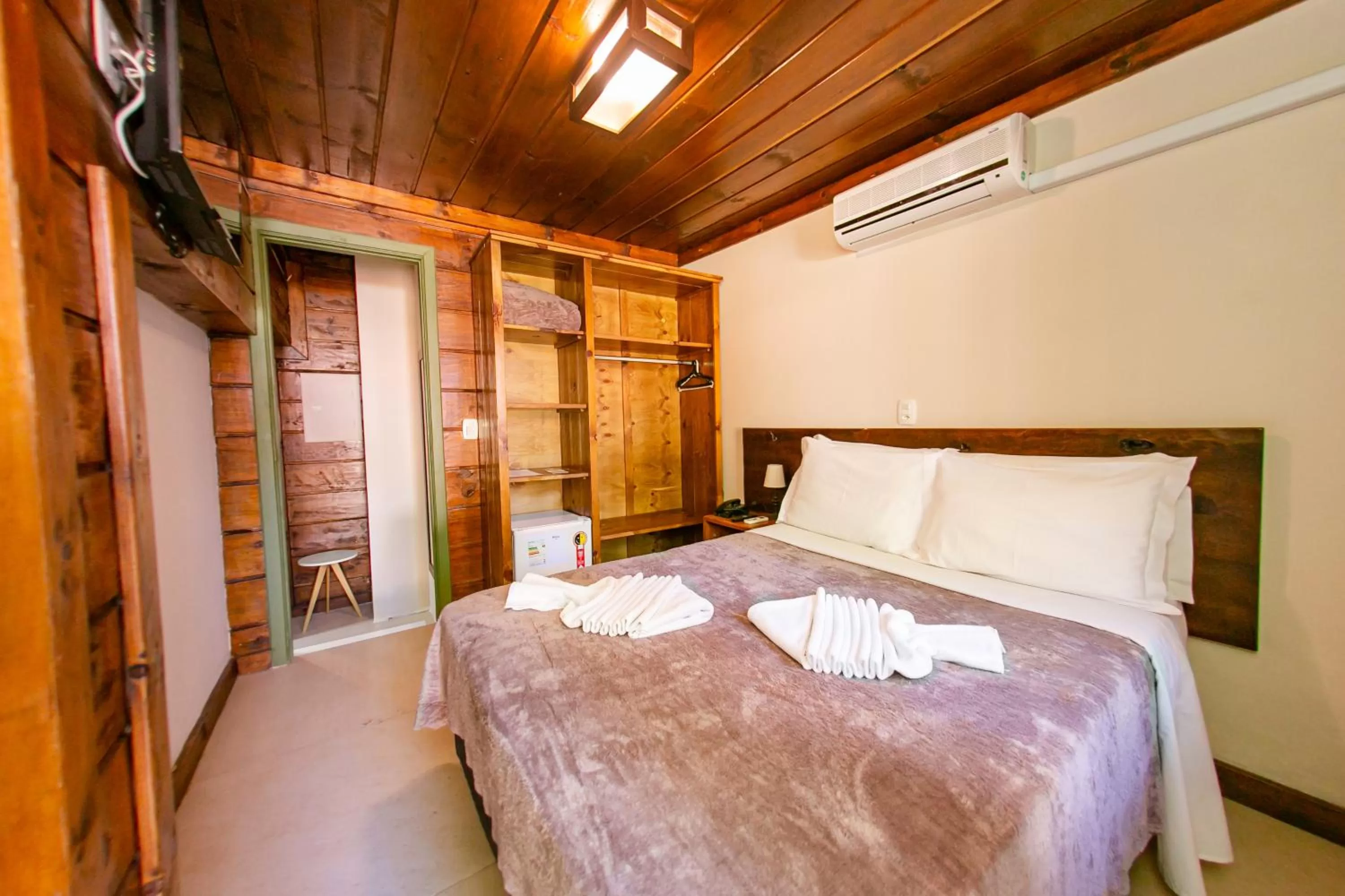 Bed in Pousada Charm Canela