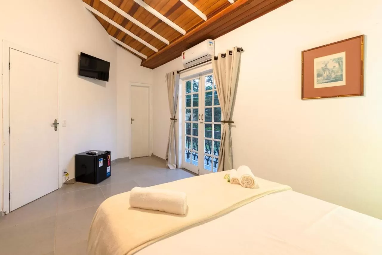 Bed in Pousada Portal de Paraty