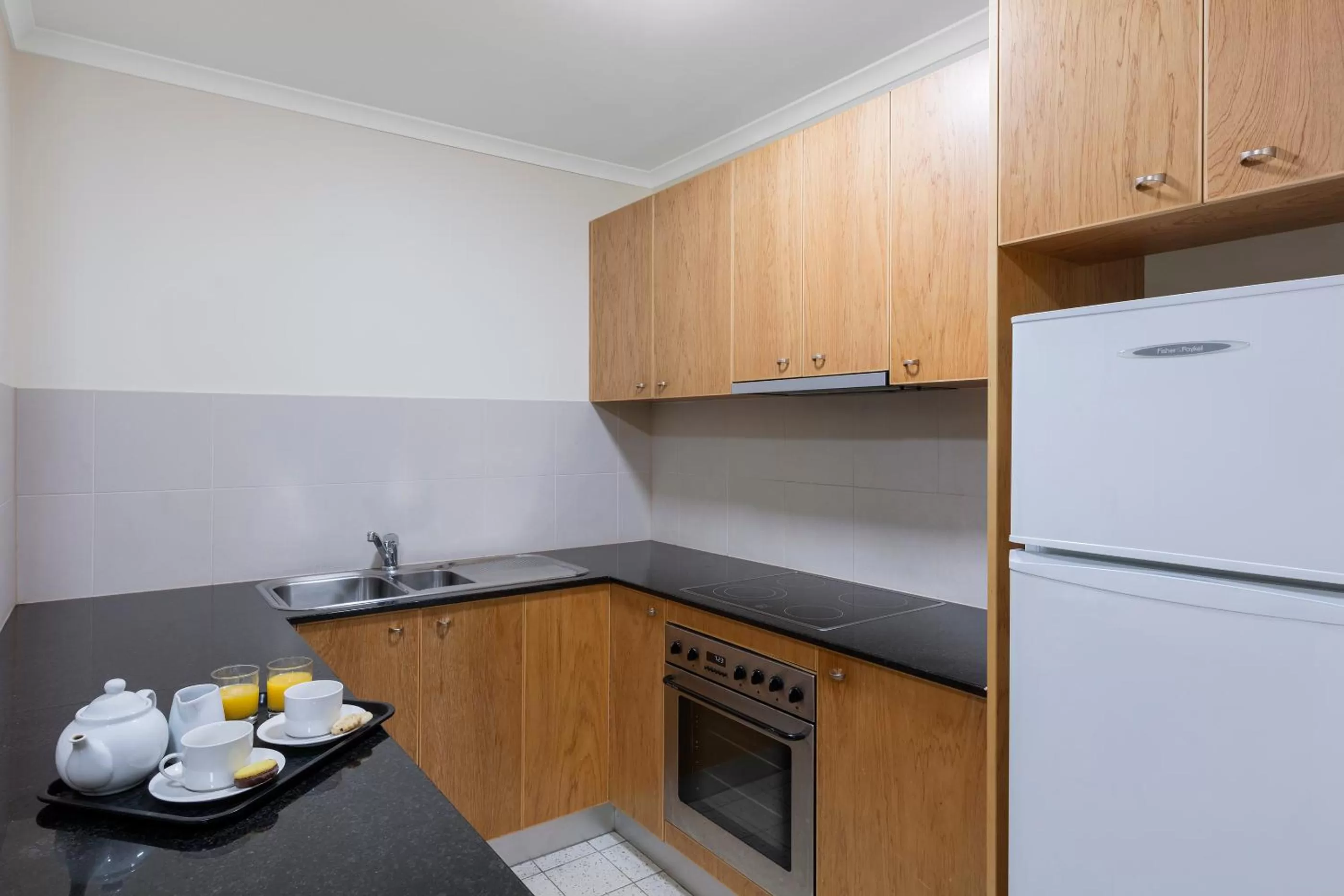 Kitchen or kitchenette in Nesuto Canberra