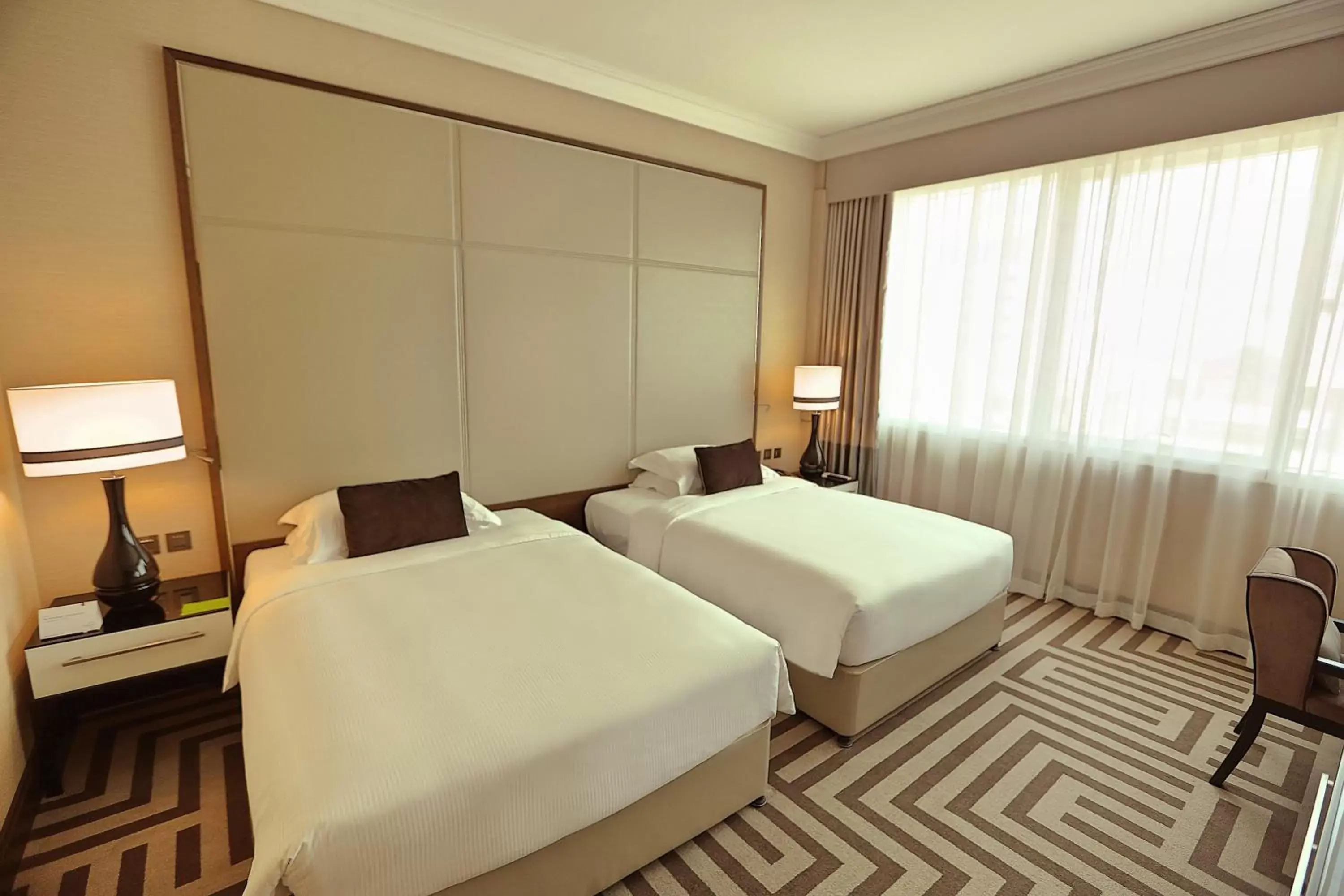 Guest Room - Twin Beds in Al Maha Arjaan by Rotana Guest Room - Twin Beds in Al Maha Arjaan by Rotana