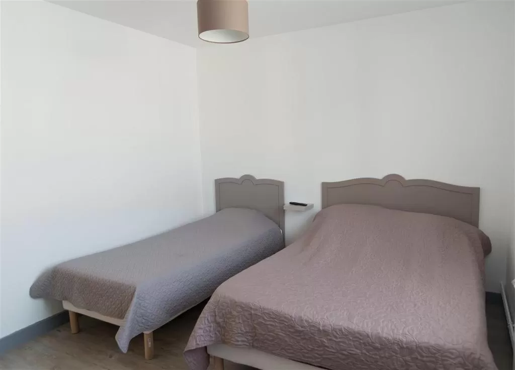 Bed in HOTEL DU CYGNE DE LA CROIX BLANCHE