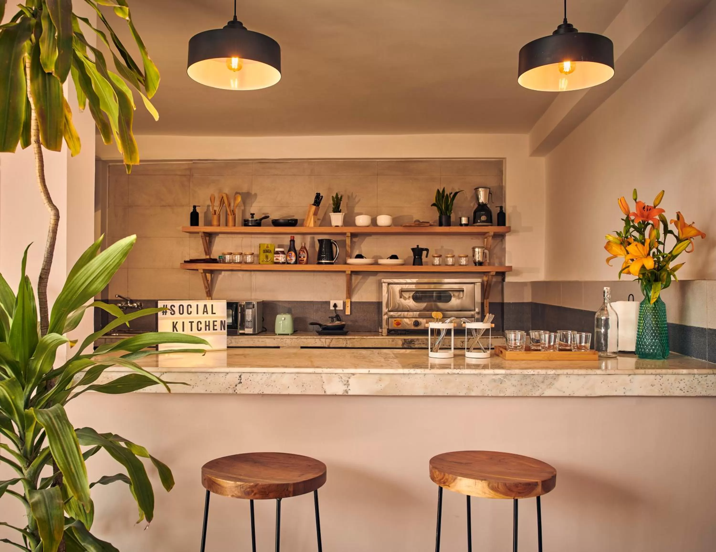 Communal kitchen in Minimalist Poshtel & Suites