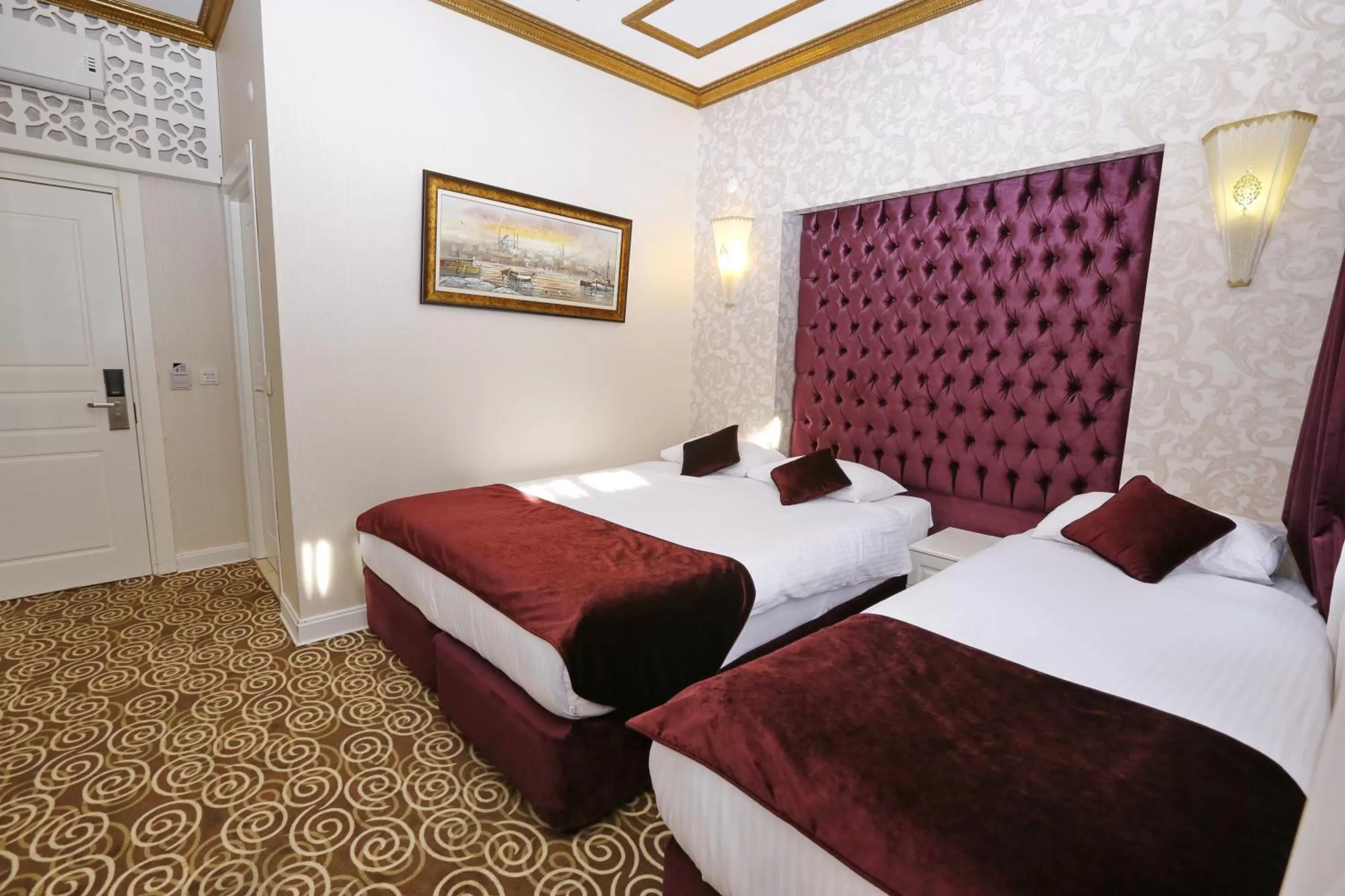 Bed in Diamond Royal Hotel
