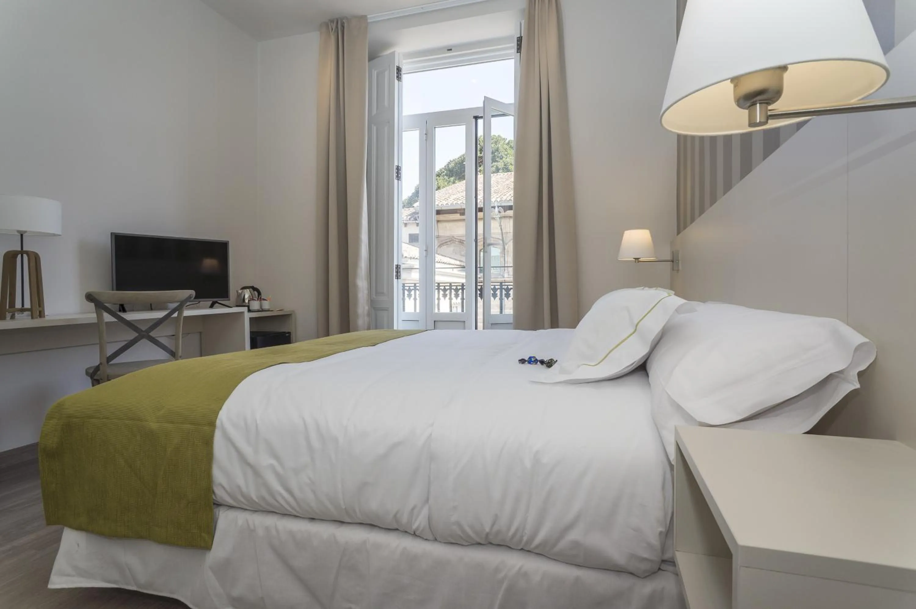 Bed in Hotel San Lorenzo Boutique Plaza