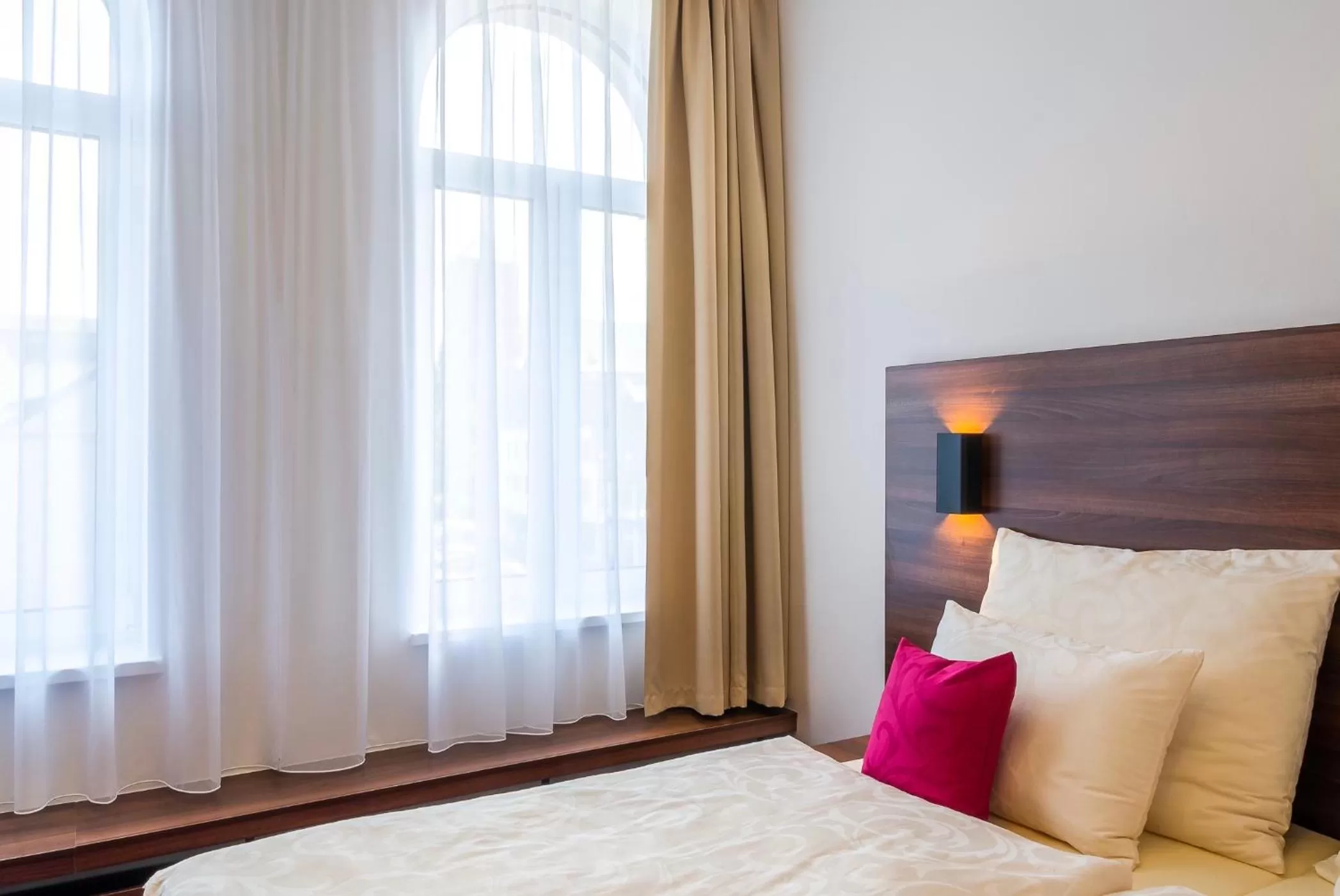 Bed in Bohemia Inn Hotel