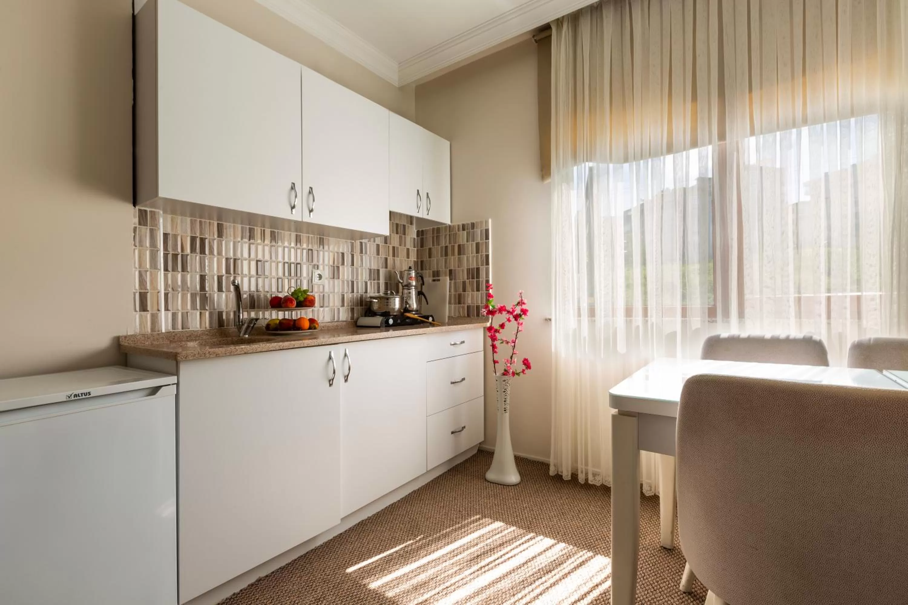 Kitchen/Kitchenette in Bikka&Asell Suite Hotel