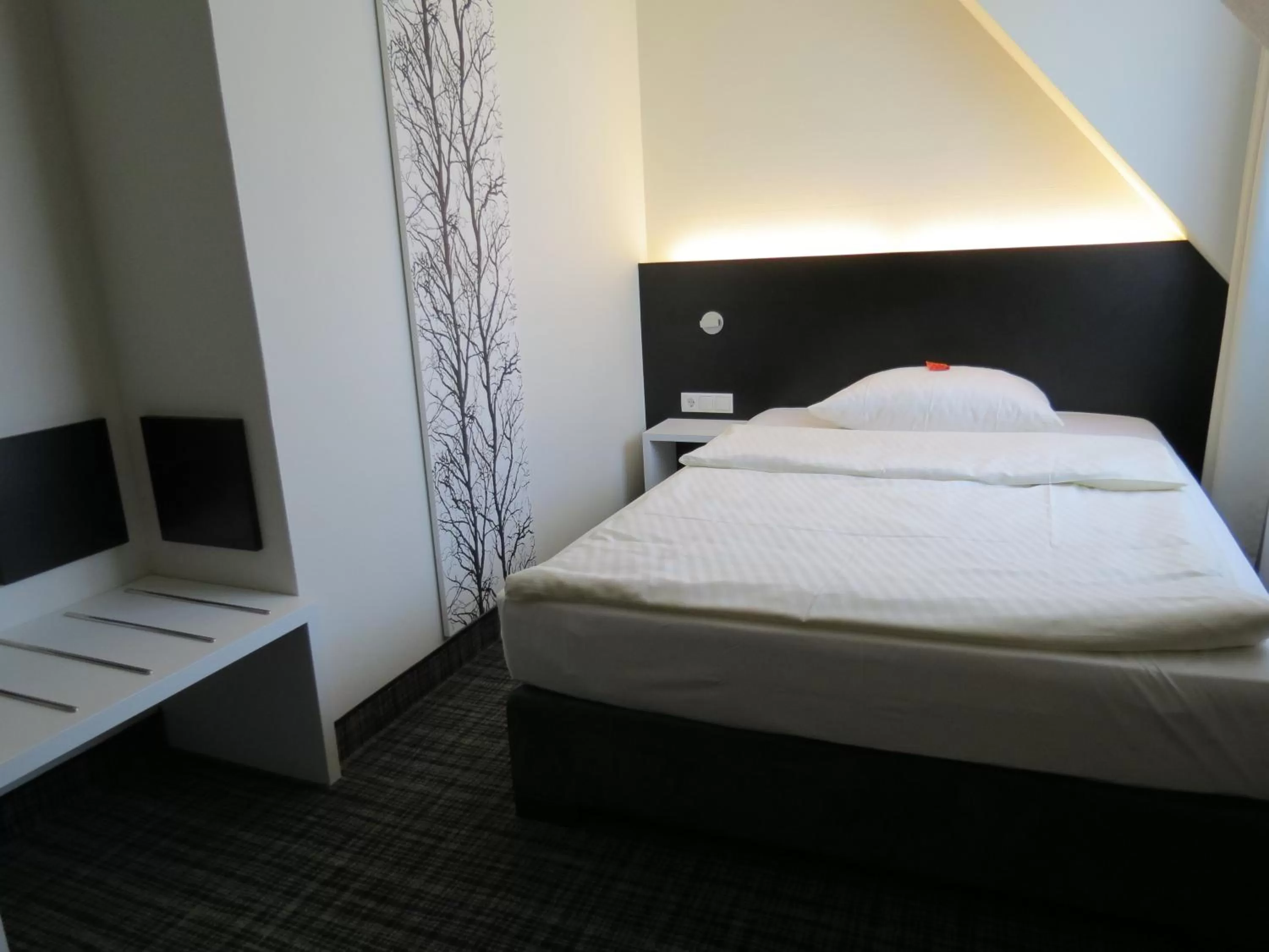 Bed in Comfor Hotel Ulm City