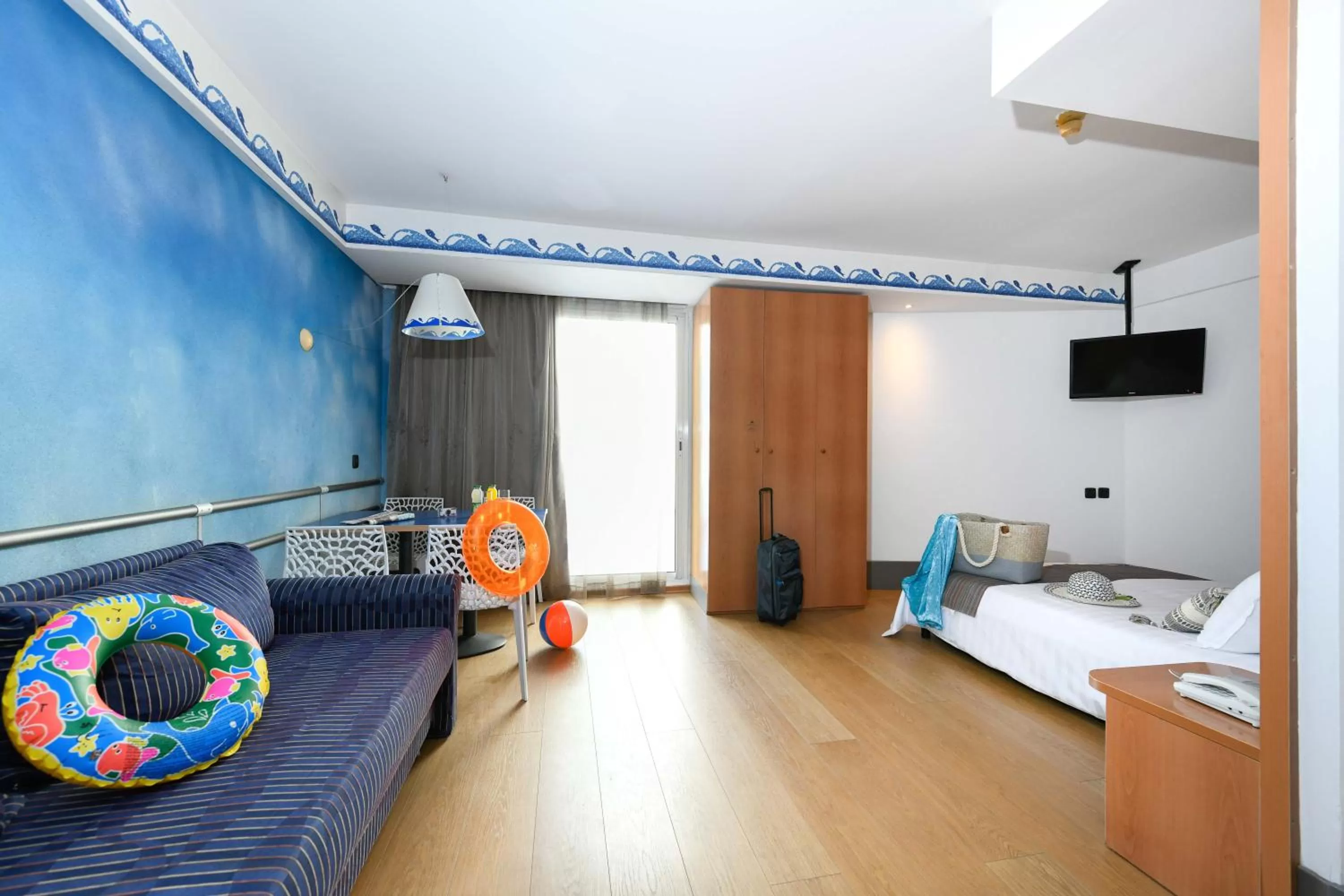 Bed, Seating Area in Club Hotel Eilat - All Suites Hotel