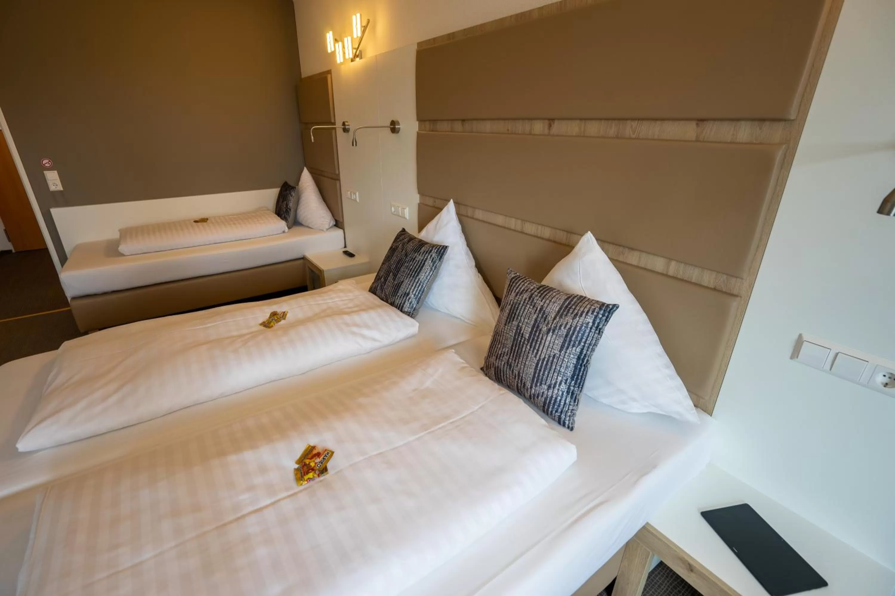 Bed in Confour Hotel