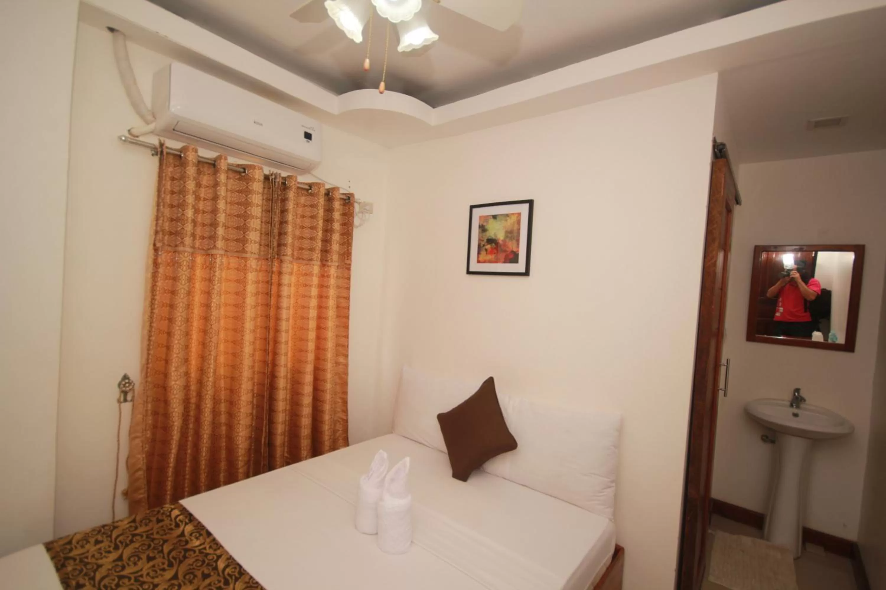 Bed in El Nido Royal Palm Inn