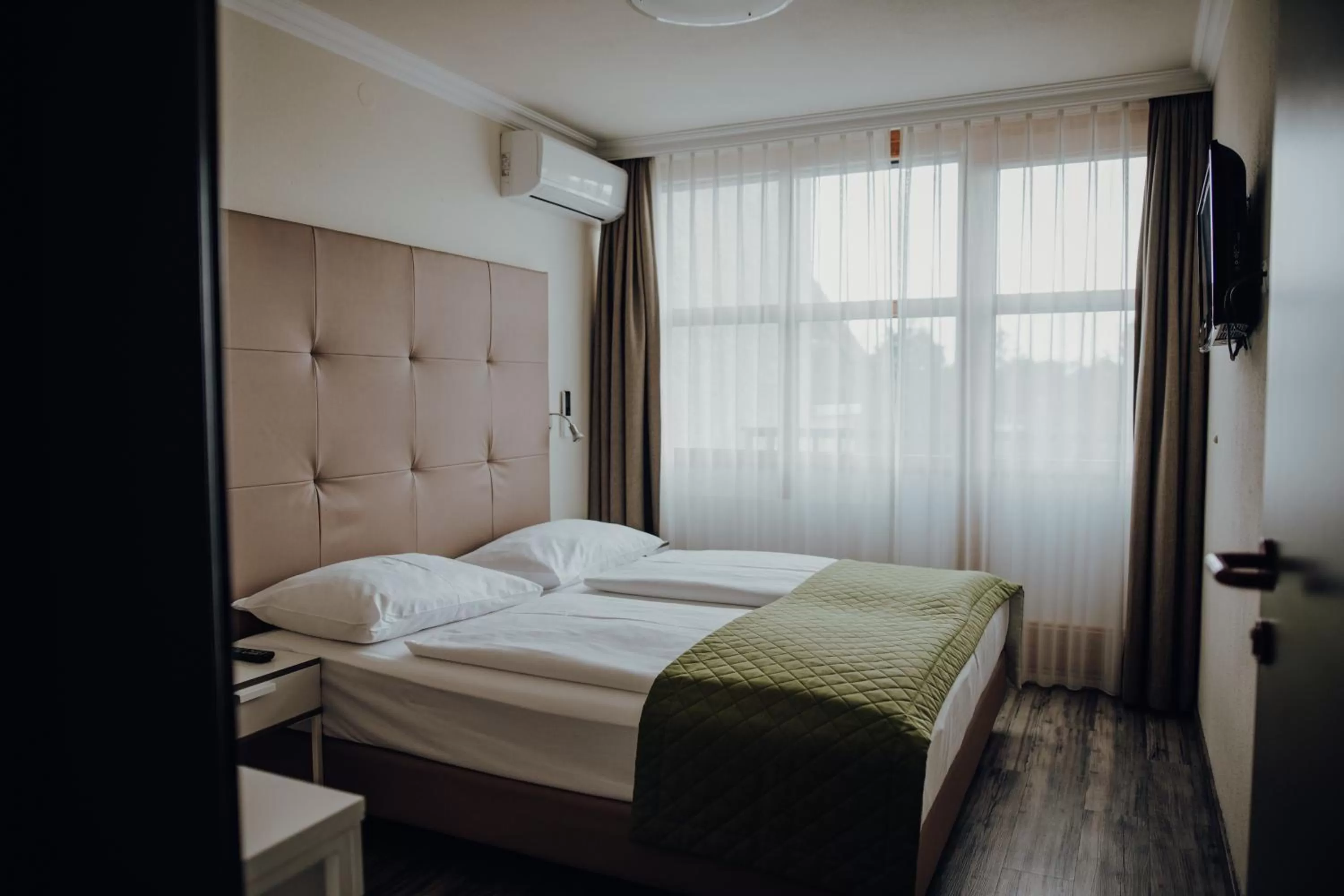 Bed in Parkhotel Brunauer