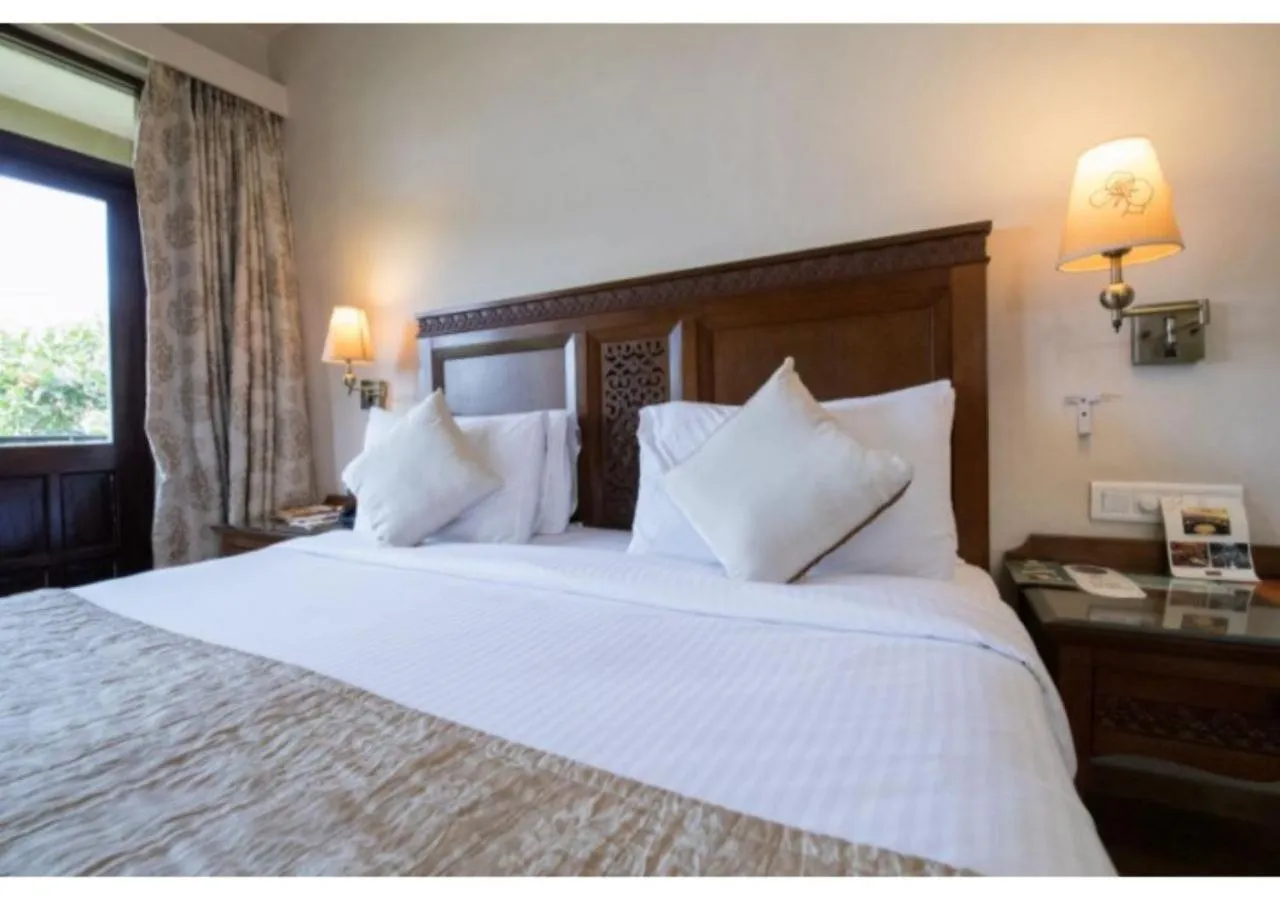 Bed in Neelam's The Grand Hotel Goa