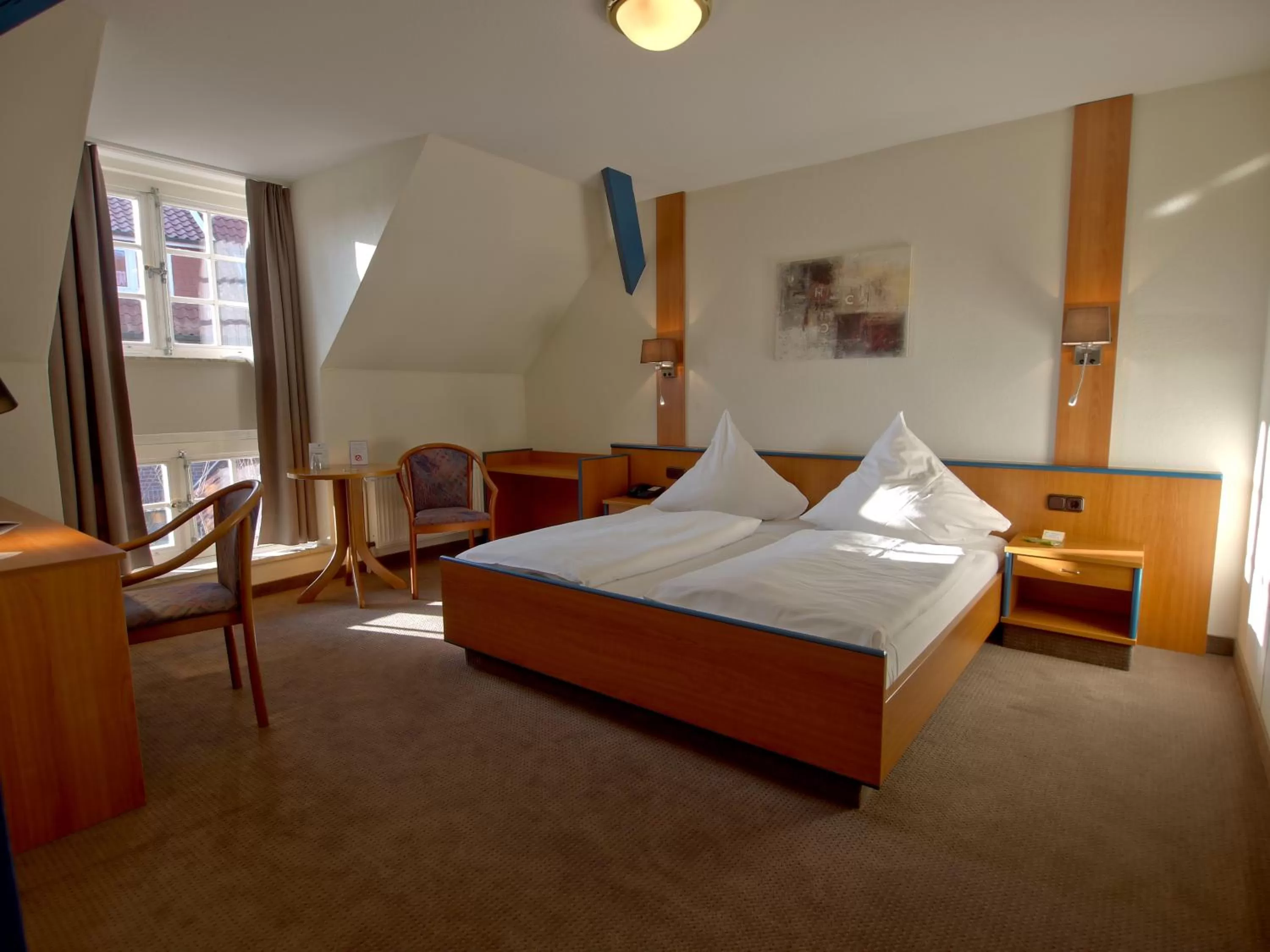 Bed in Hotel Friesische Wehde