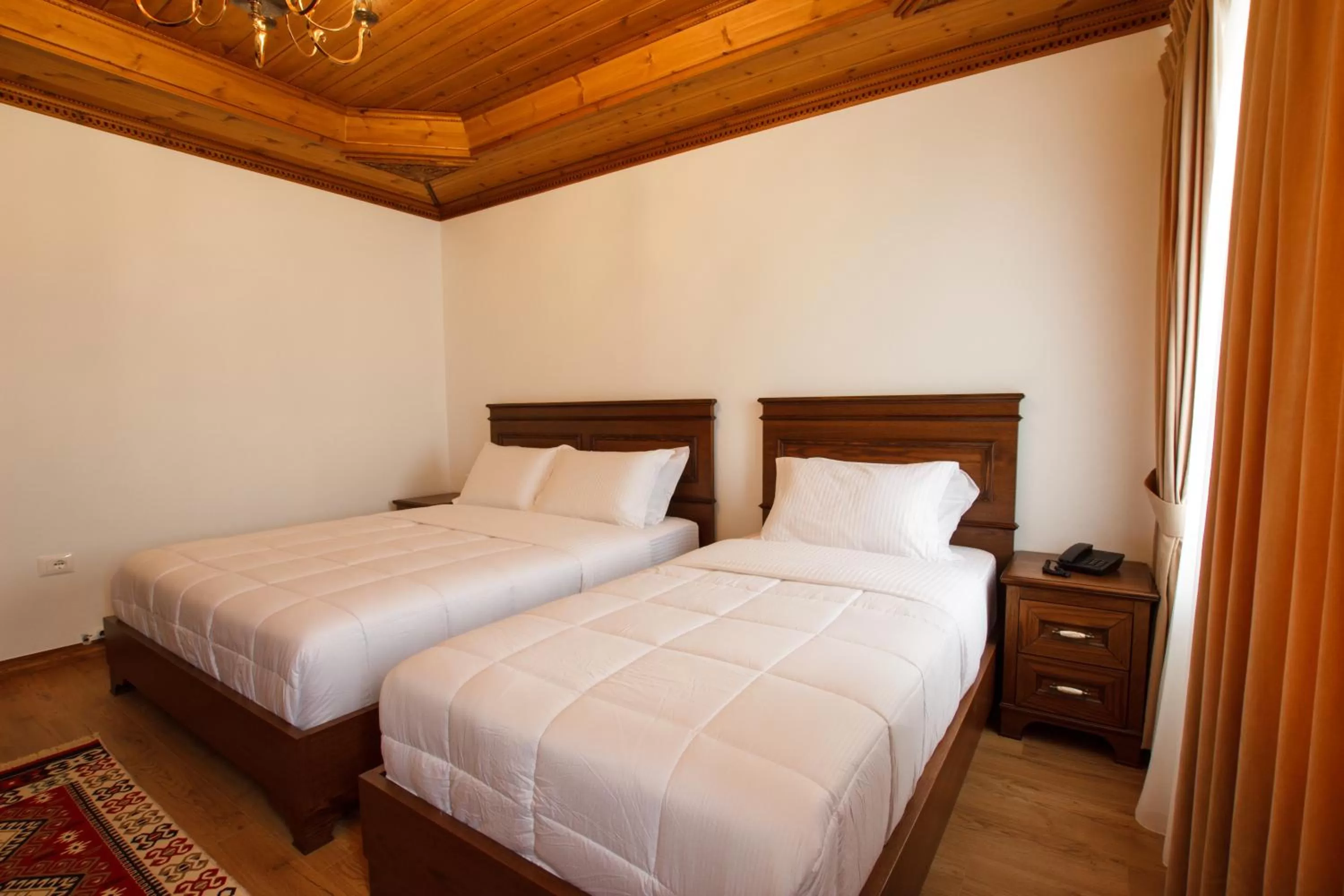 Bed in Rose Garden Hotel