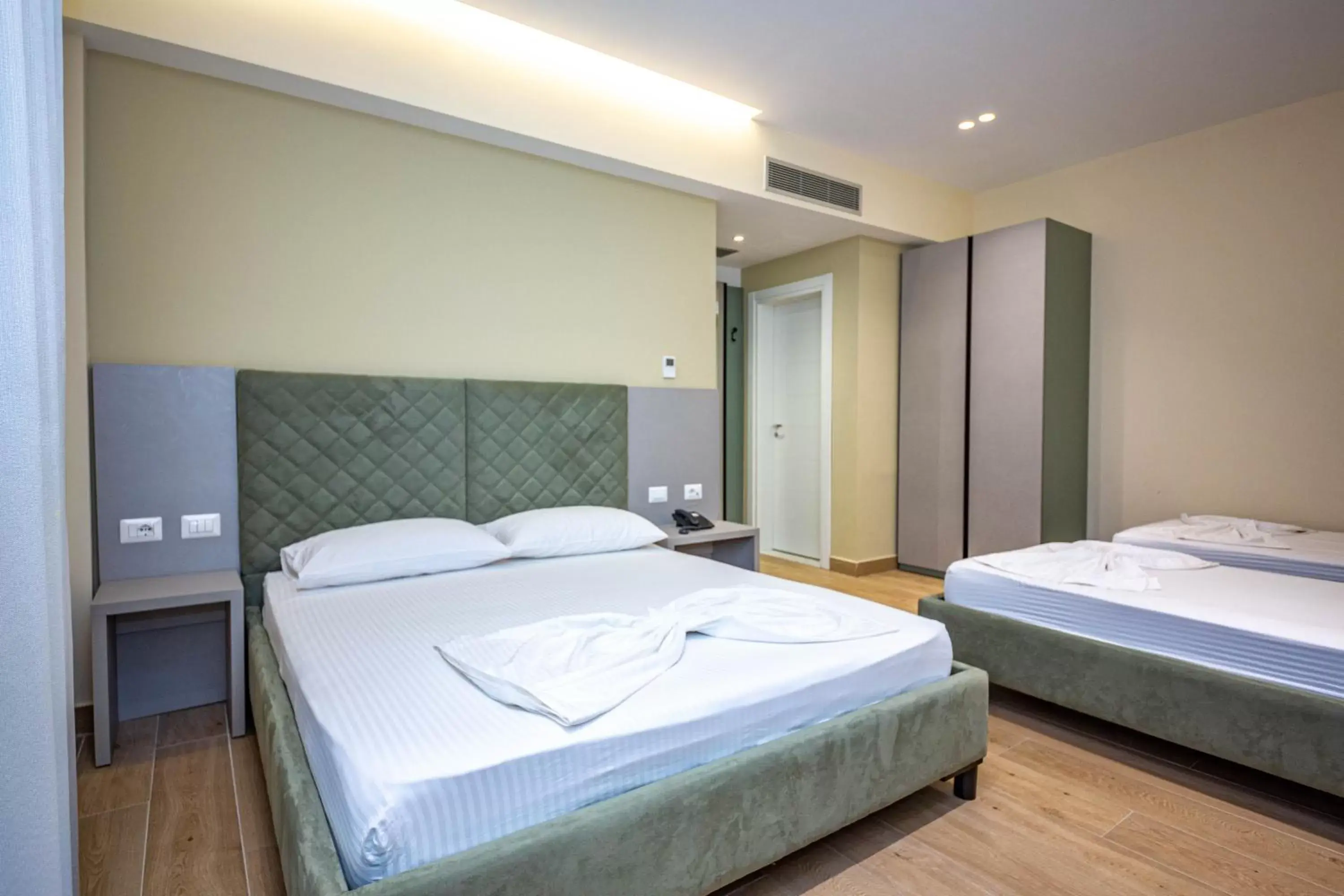 Quadruple Room with Balcony and Side Sea View in Hotel Bella Vista Quadruple Room with Balcony and Side Sea View in Hotel Bella Vista