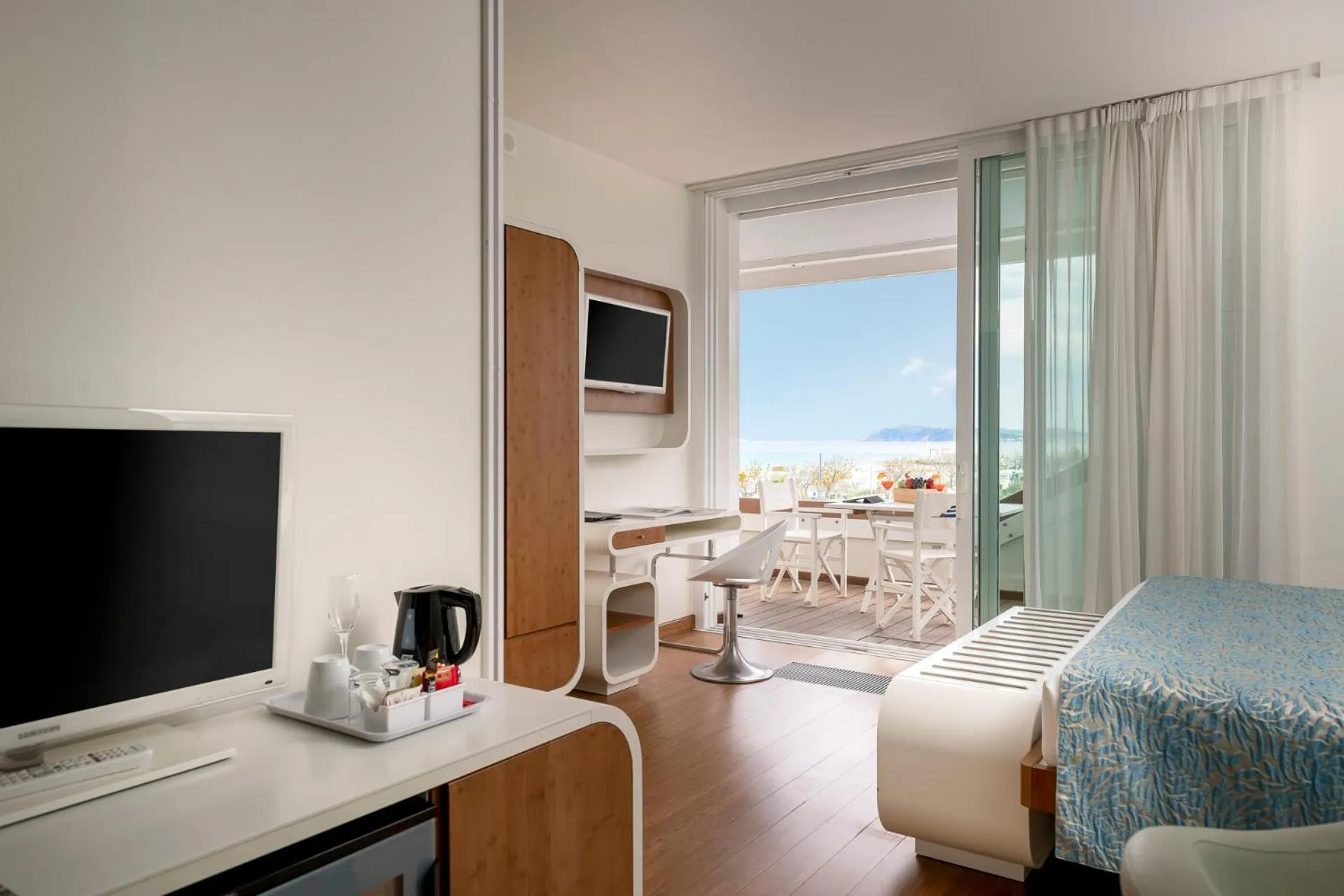 Bed in T-Suite Hotel