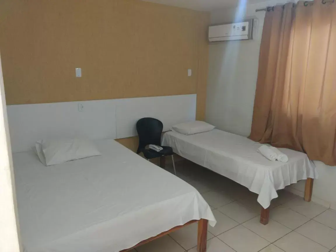 Economy Triple Room in Hotel Serra do Rio Economy Triple Room in Hotel Serra do Rio