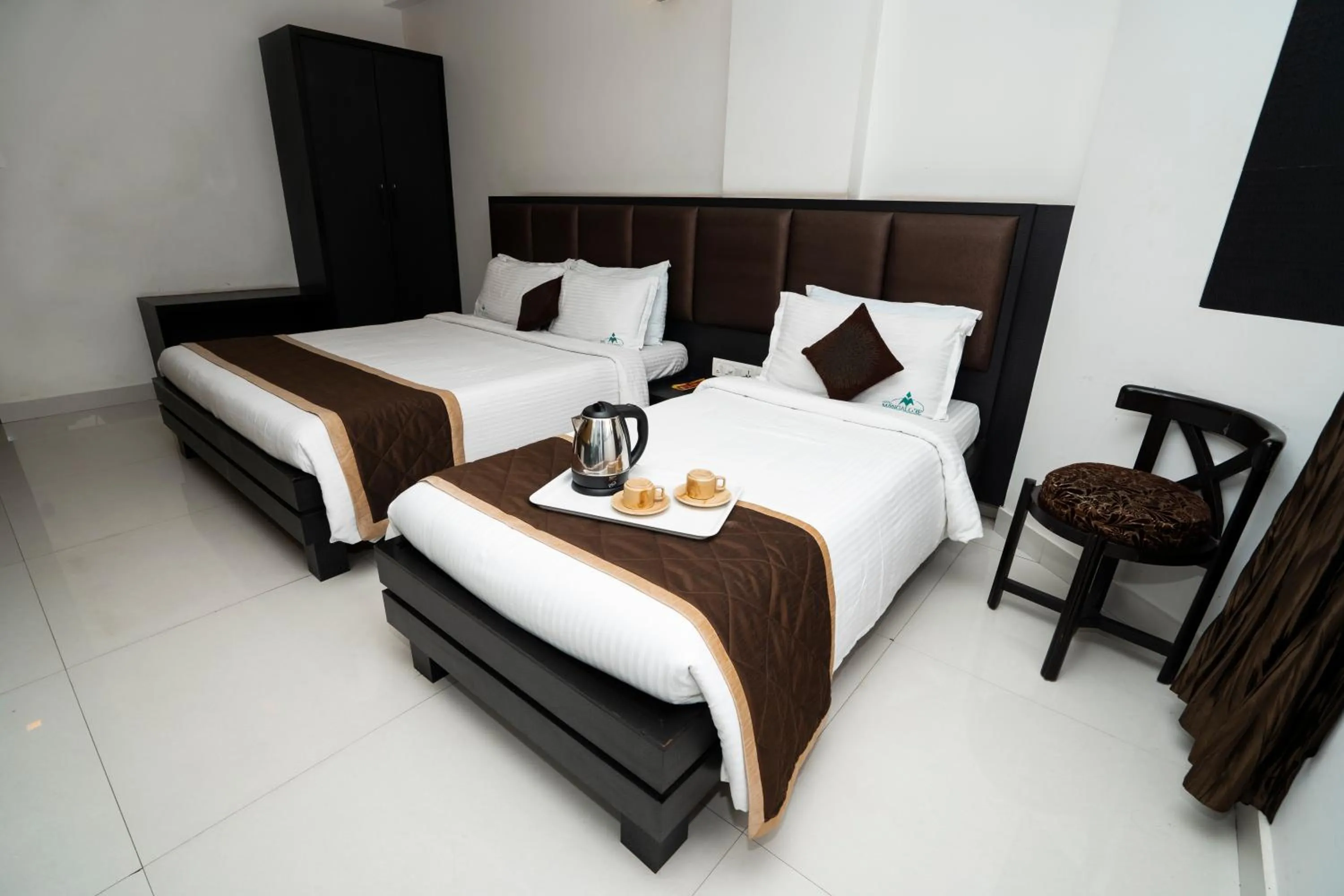 Bed in Hotel Mangalore International