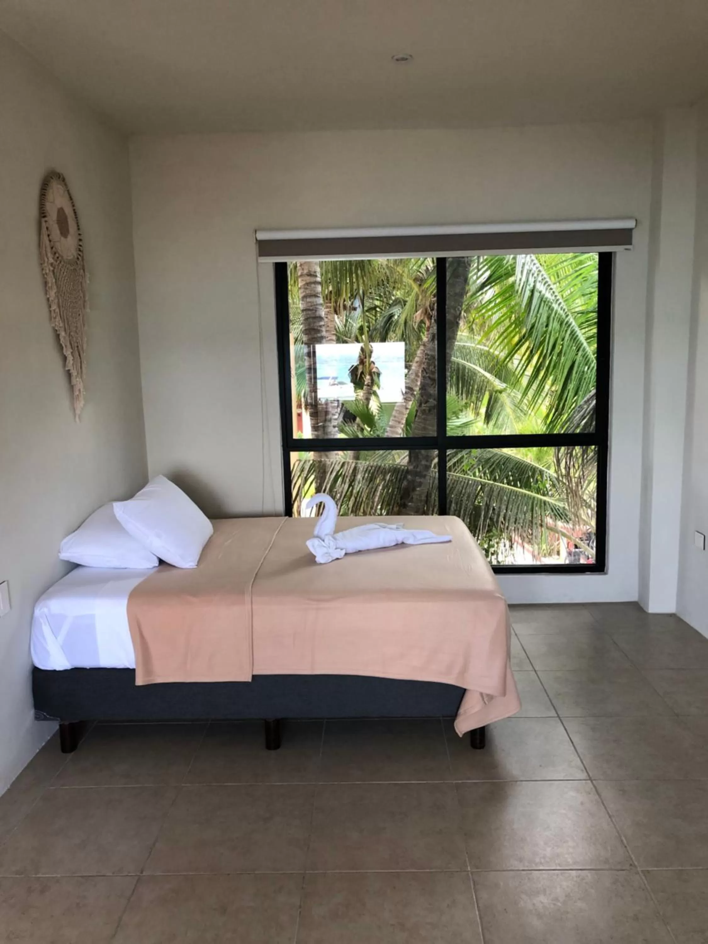 Bed in Cuxos Hotel Beachfront