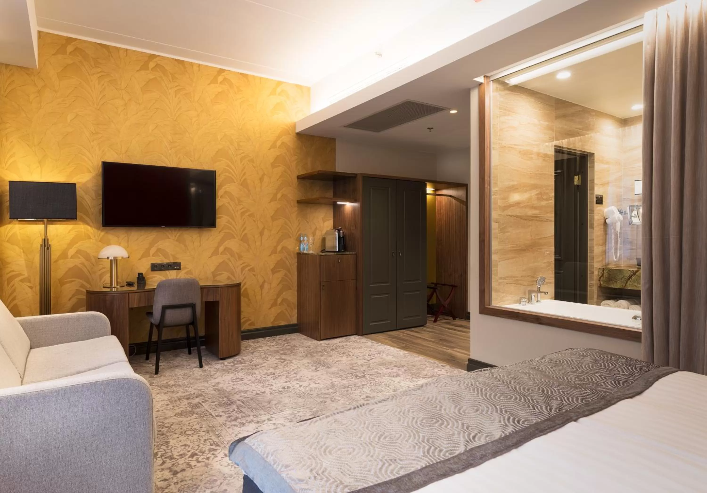 Living room, Bed in V Spa & Conference Hotel