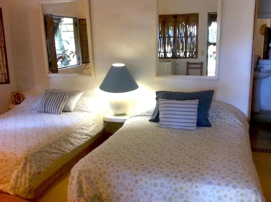 Bed in Junto al Rio Bungalows & Suites