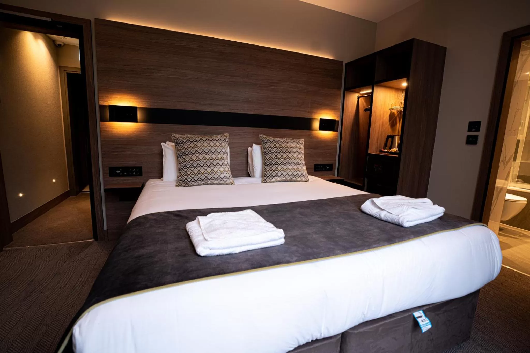 Bed in Merit Kensington Hotel