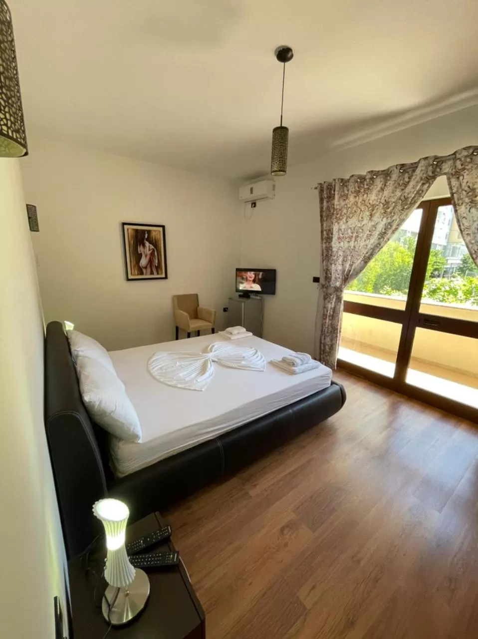 Bed in Hotel Ambasador Garden