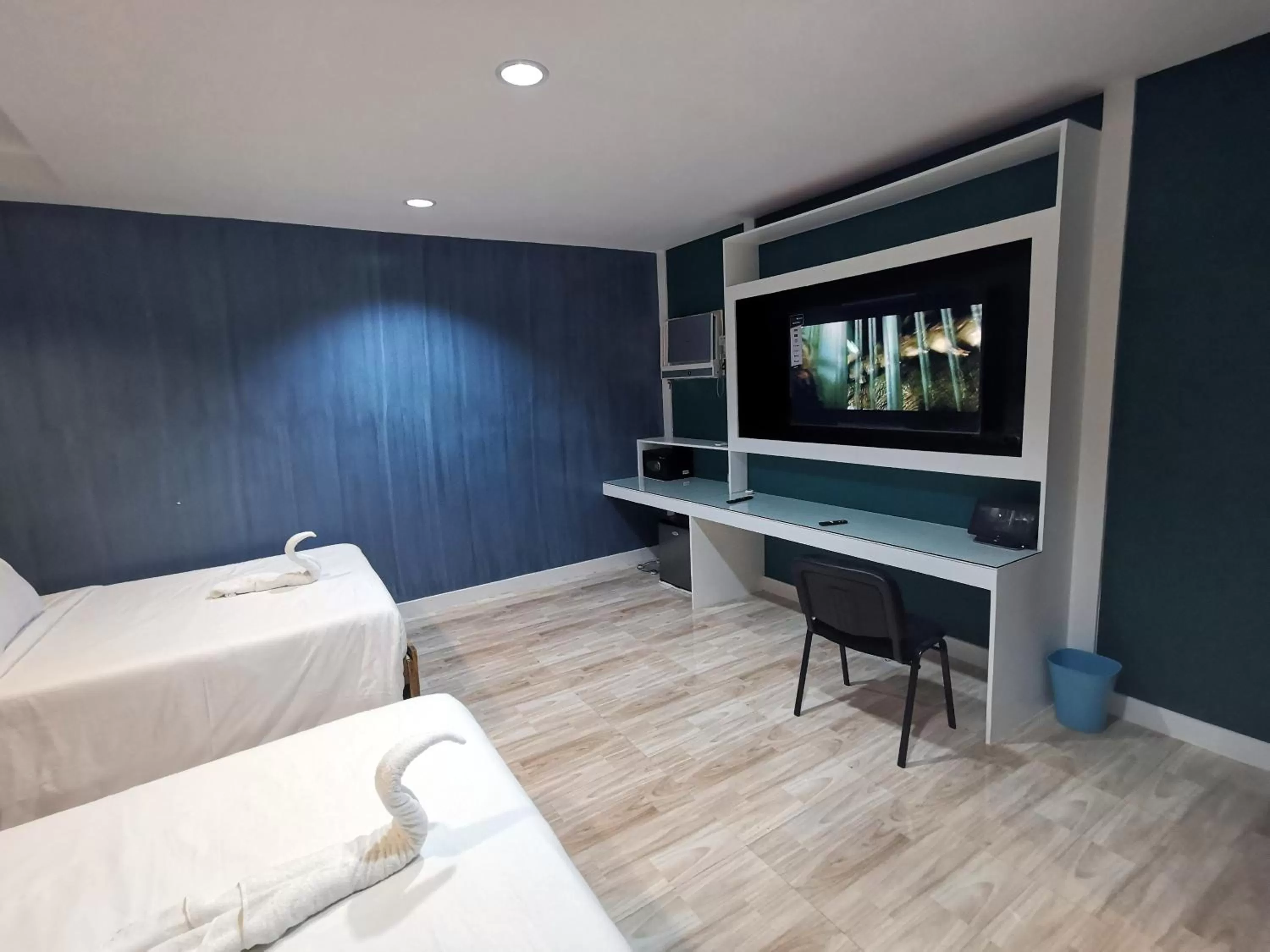 Bedroom, TV/Entertainment Center in Pescadores Suites Moalboal