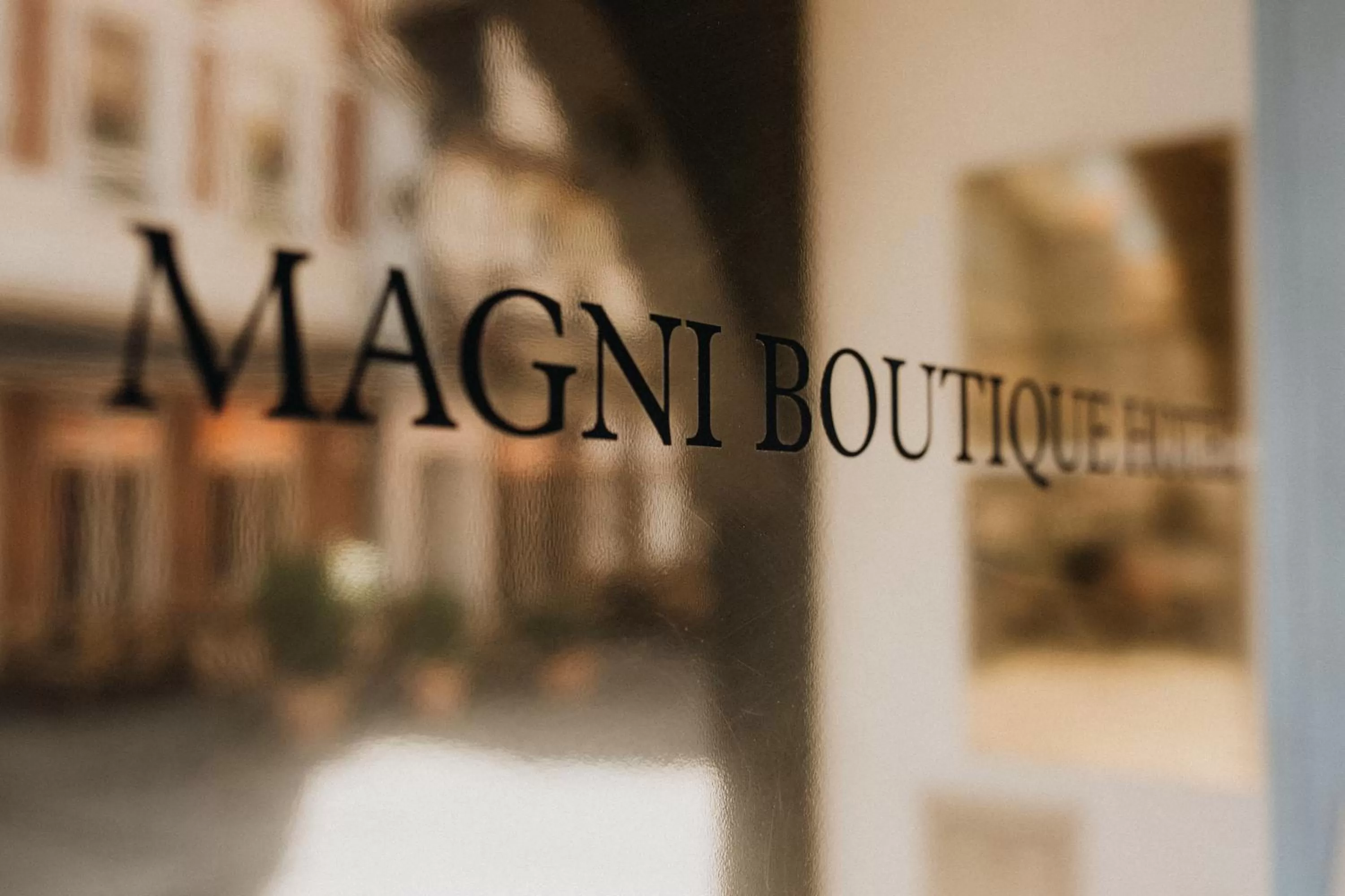 Property logo or sign in Magni Boutique Hotel