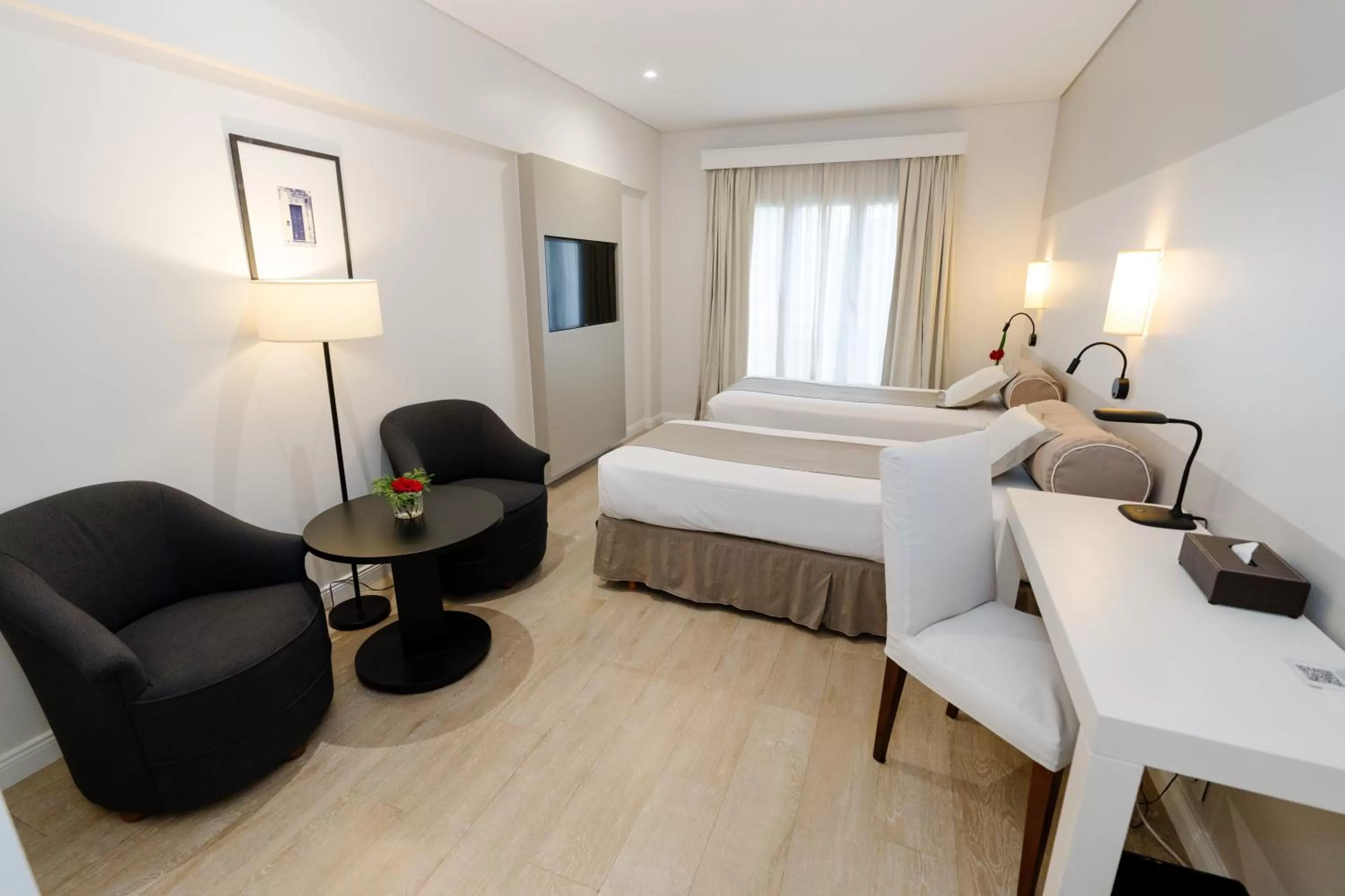 Bed in Loi Suites Recoleta Hotel