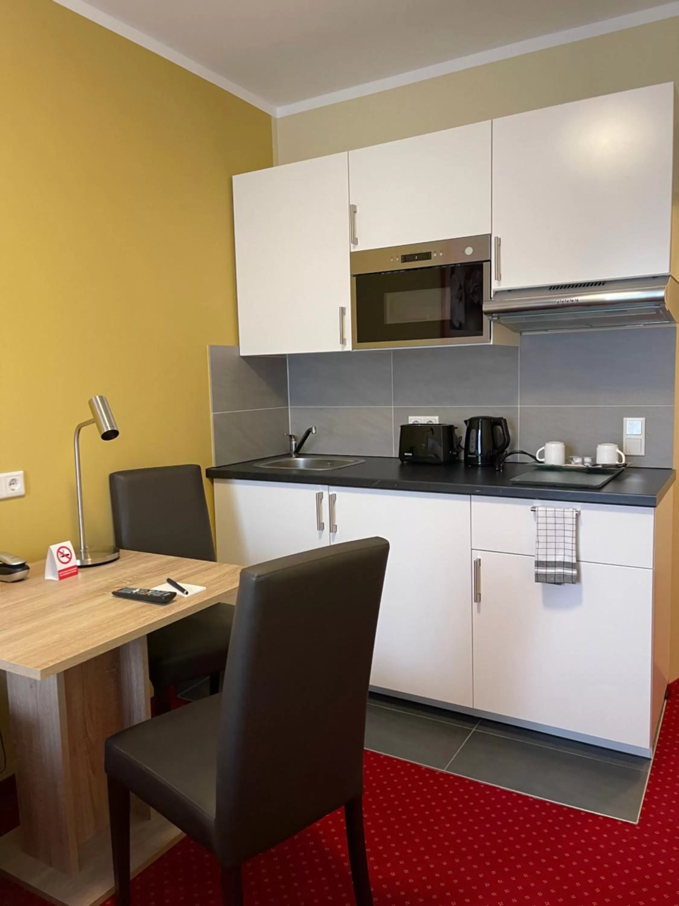 Kitchen or kitchenette in Palm Premium Hotel & Apartments
