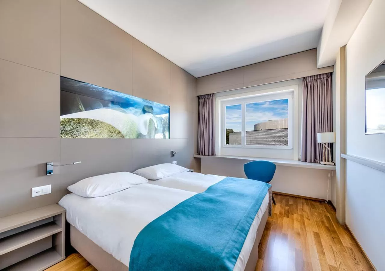 TV and multimedia, Bed in Aquatis Hotel
